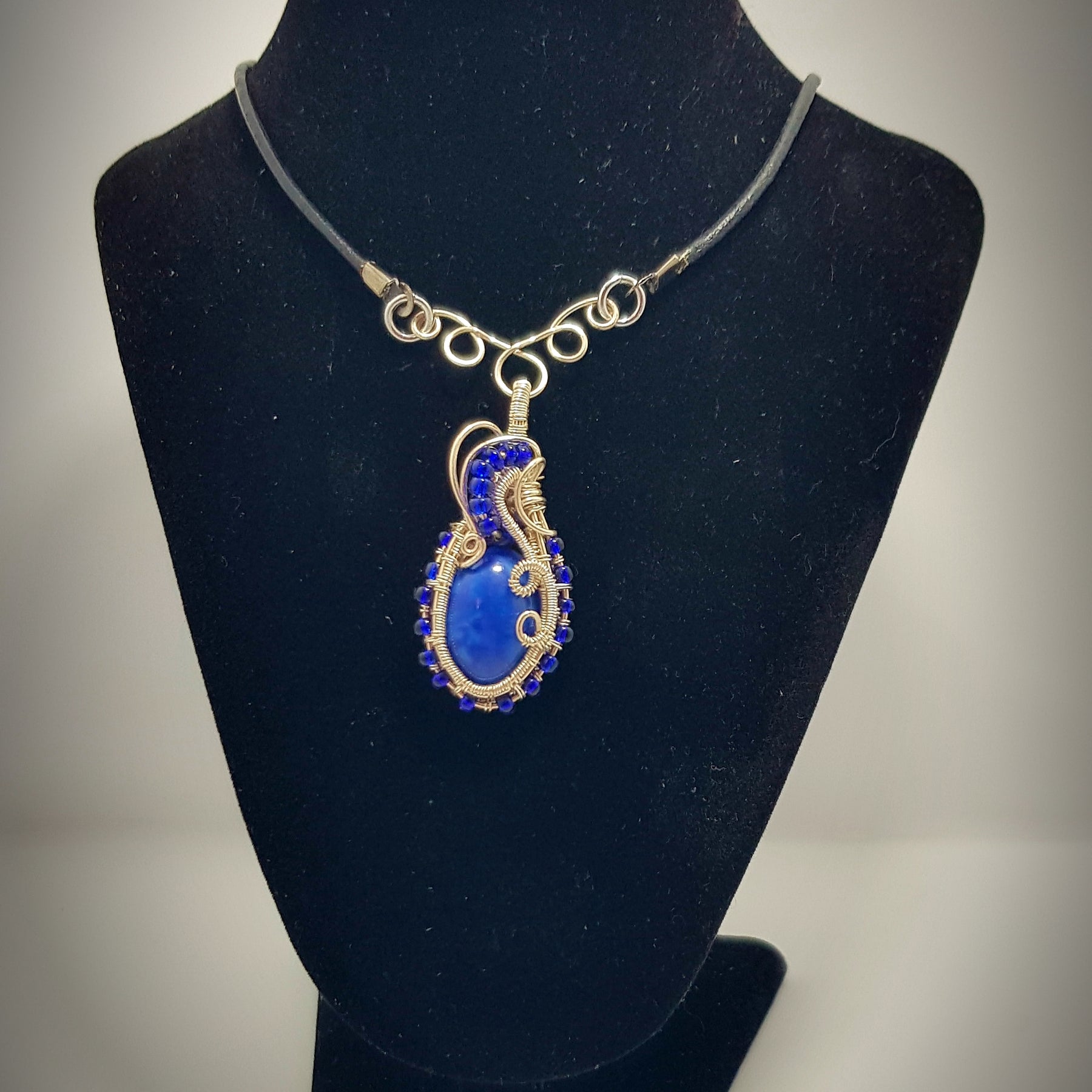small Blue cabachon wire wrapped with silver wire
