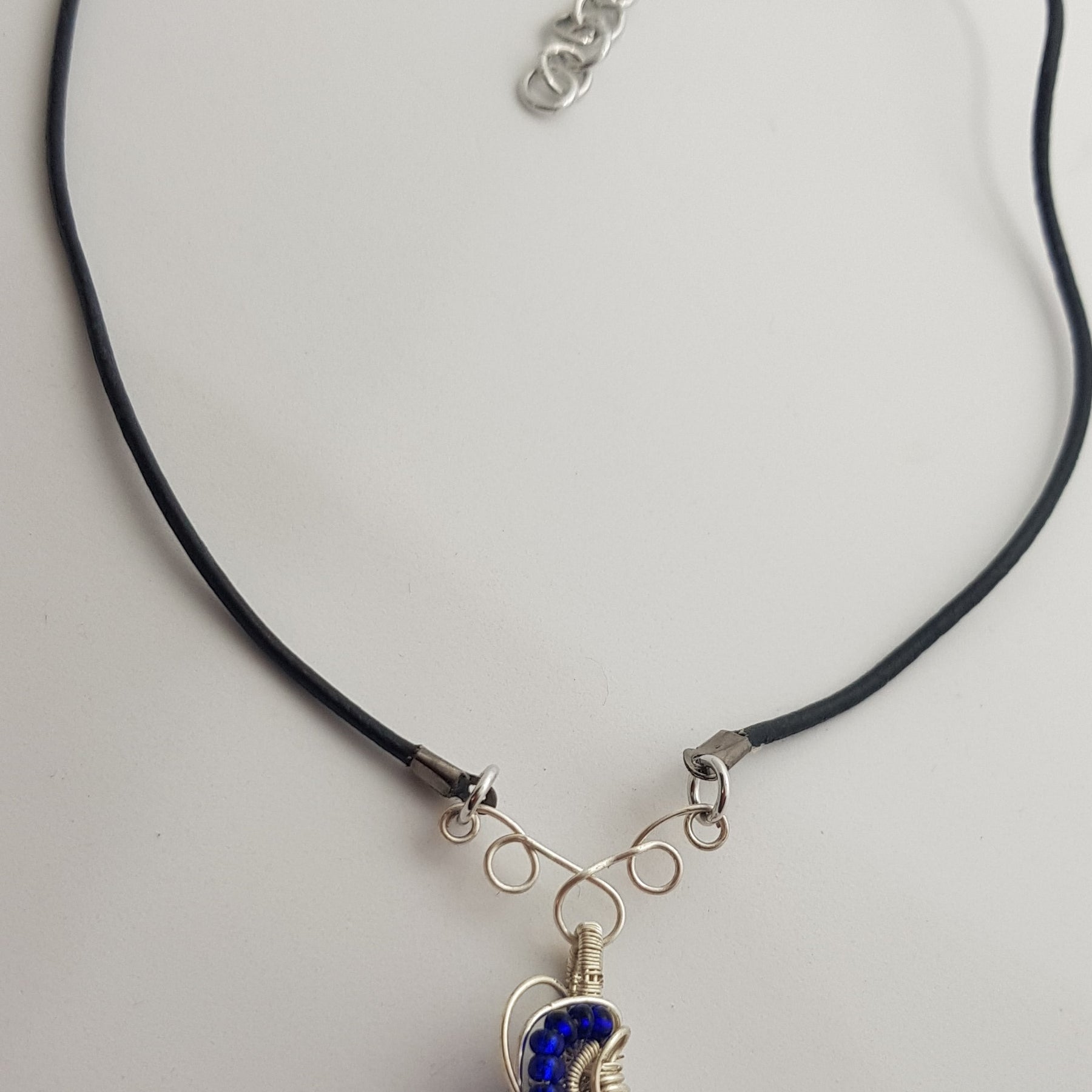 small Blue cabachon wire wrapped with silver wire