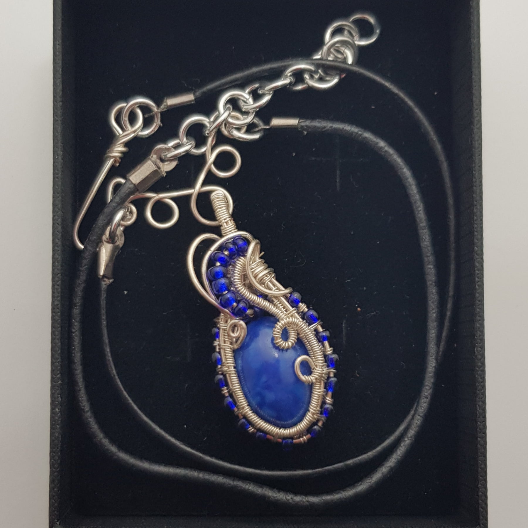 small Blue cabachon wire wrapped with silver wire
