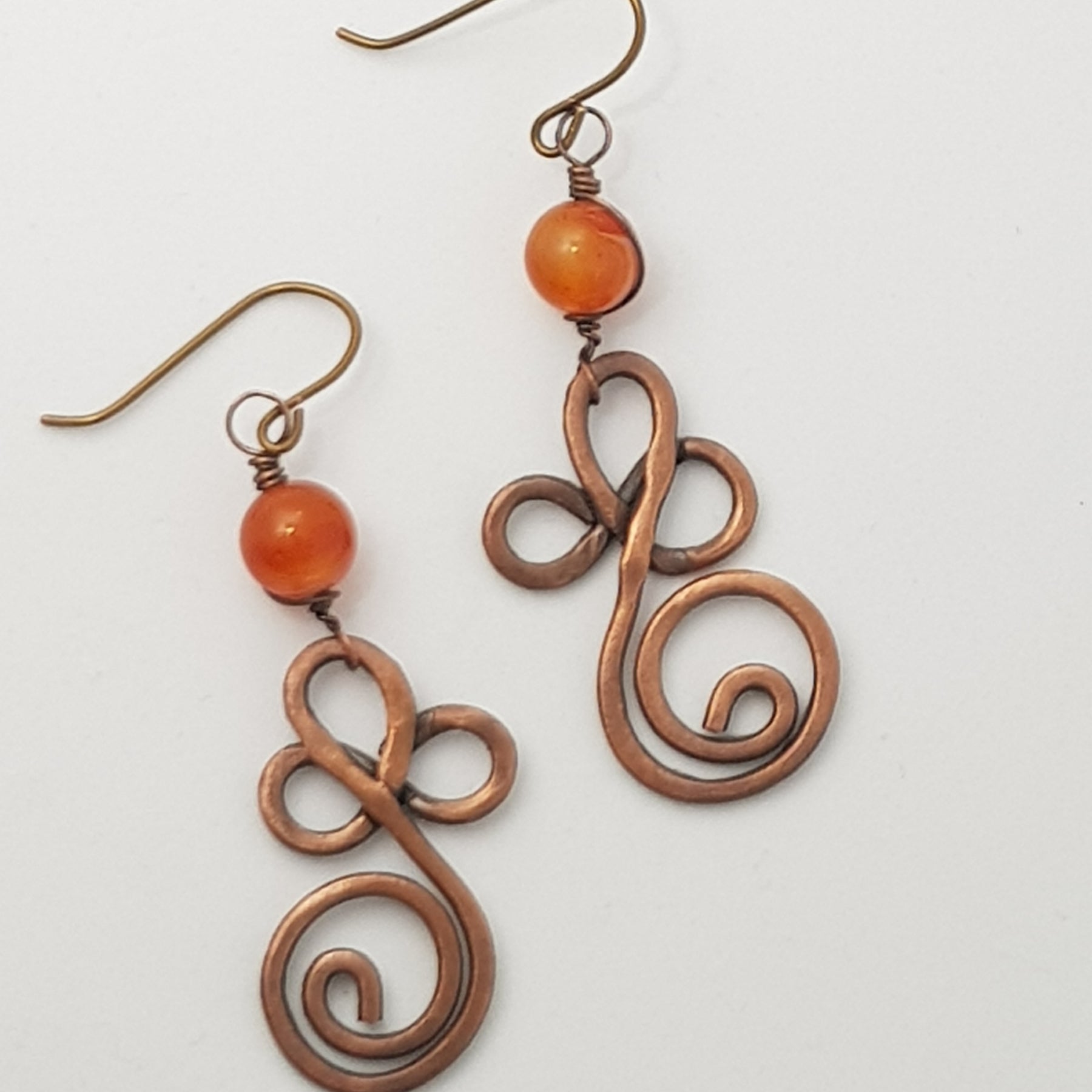 Copper swirl earrings with Carnelian bead #654 AM/E
