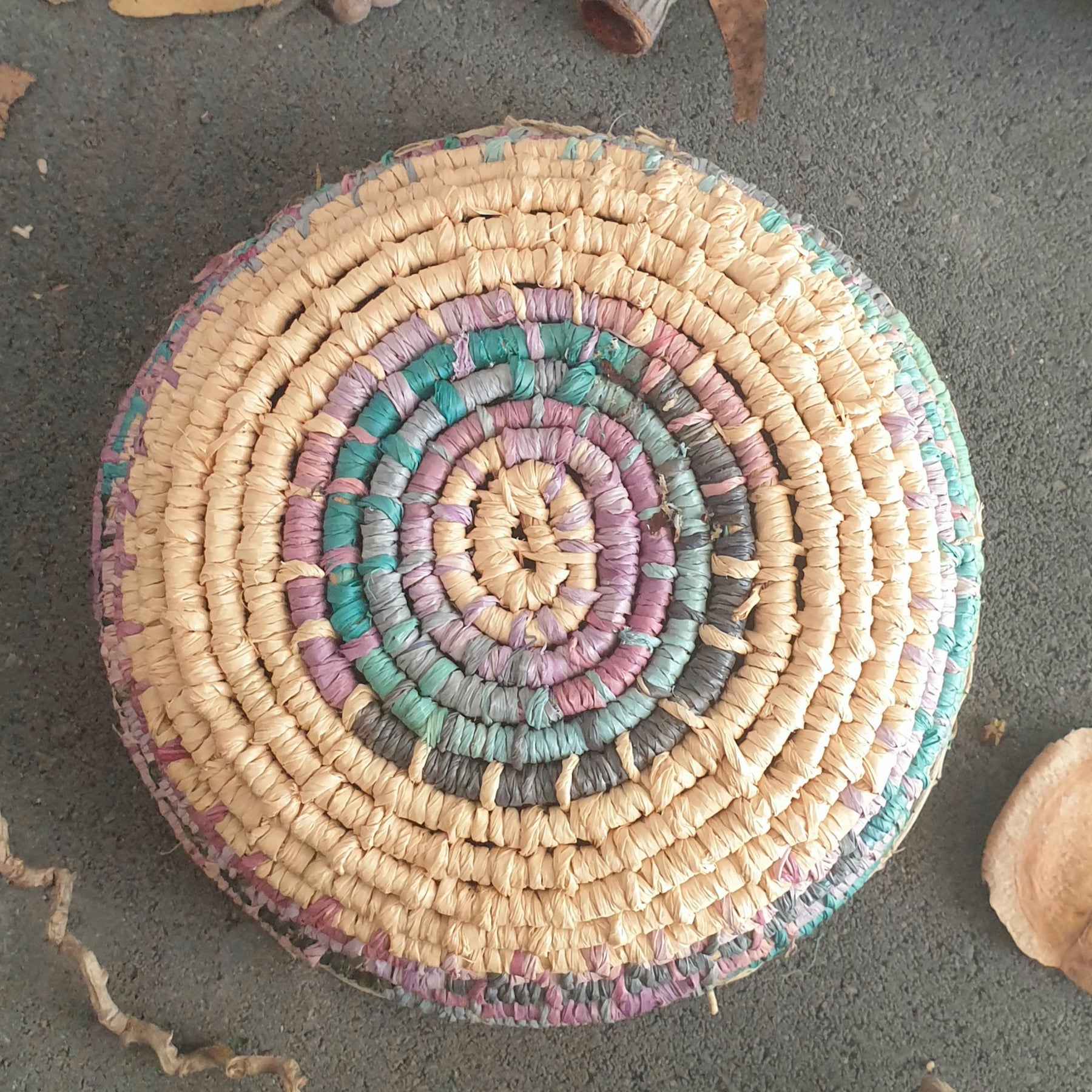 Handmade, raffia and sand vine coil basket,