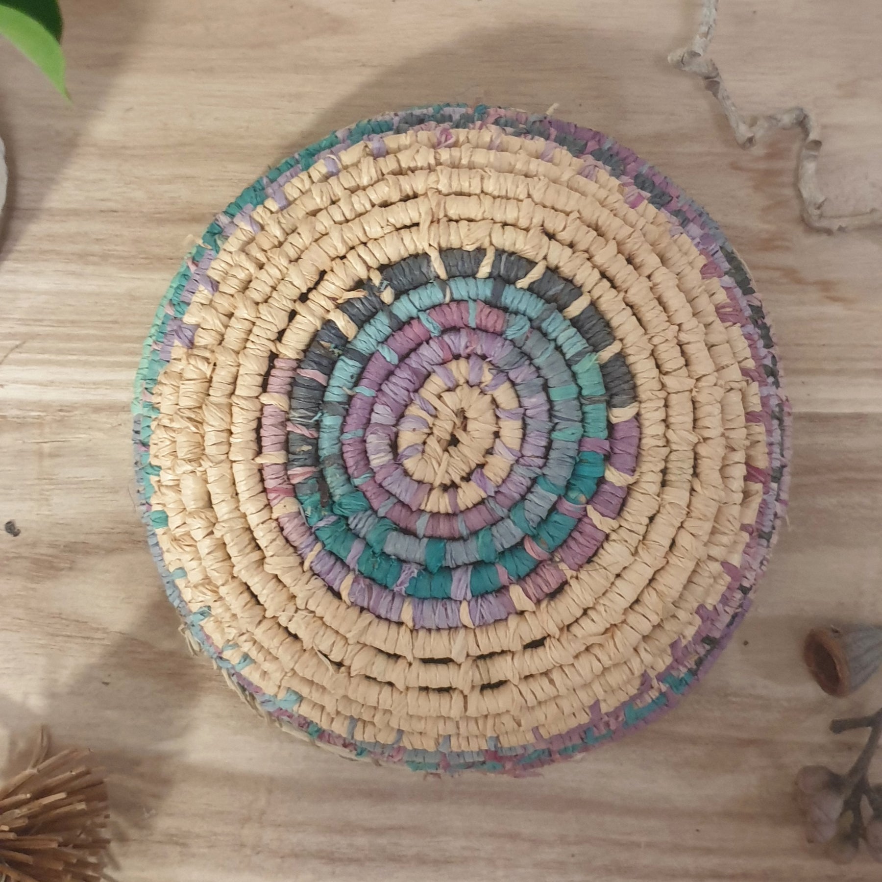 Handmade, raffia and sand vine coil basket,