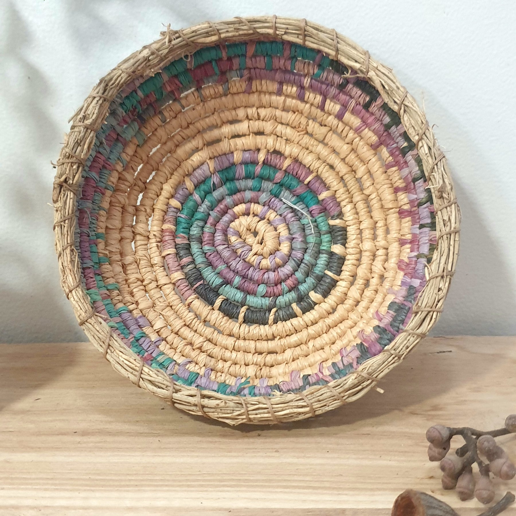 Handmade, raffia and sand vine coil basket,