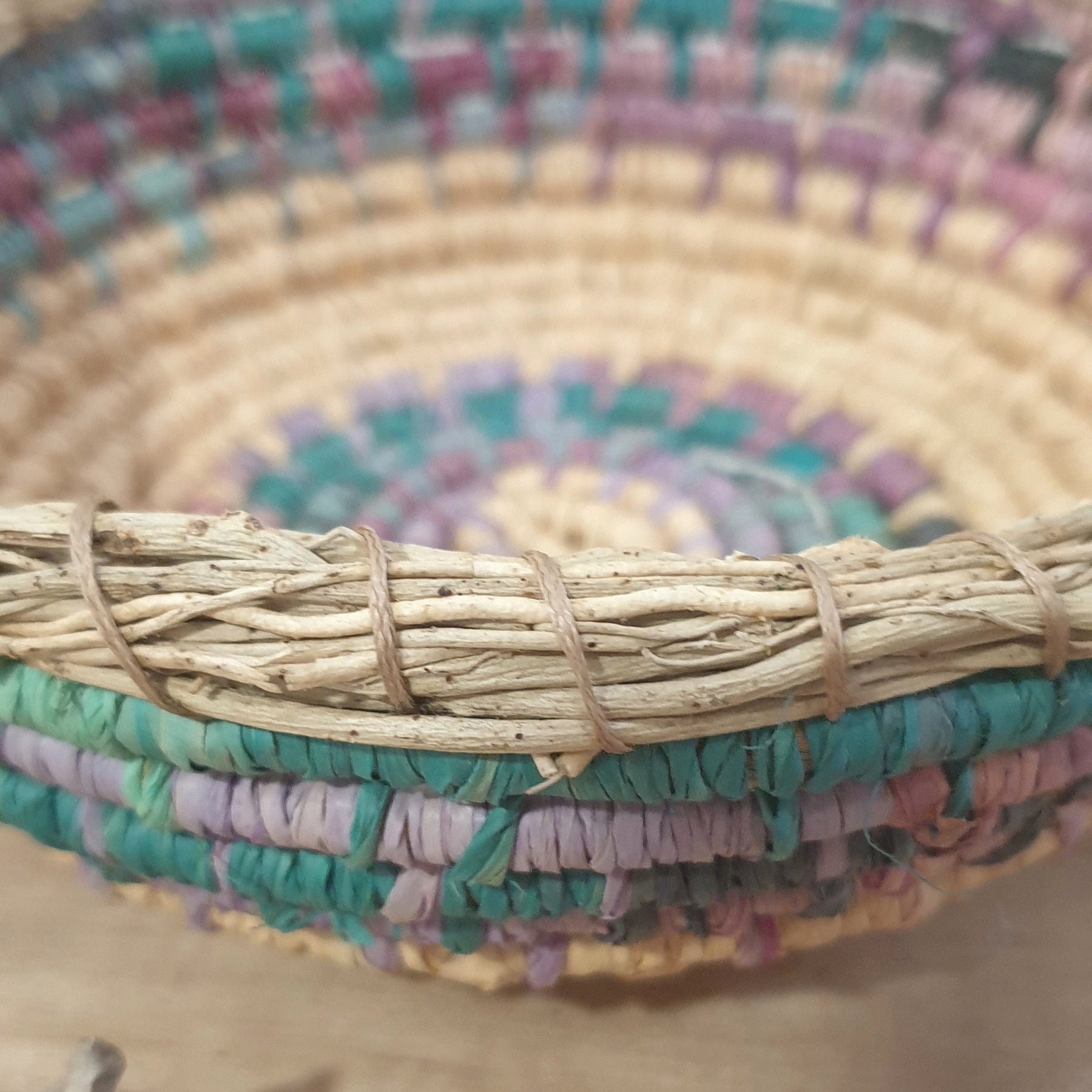 Handmade, raffia and sand vine coil basket,