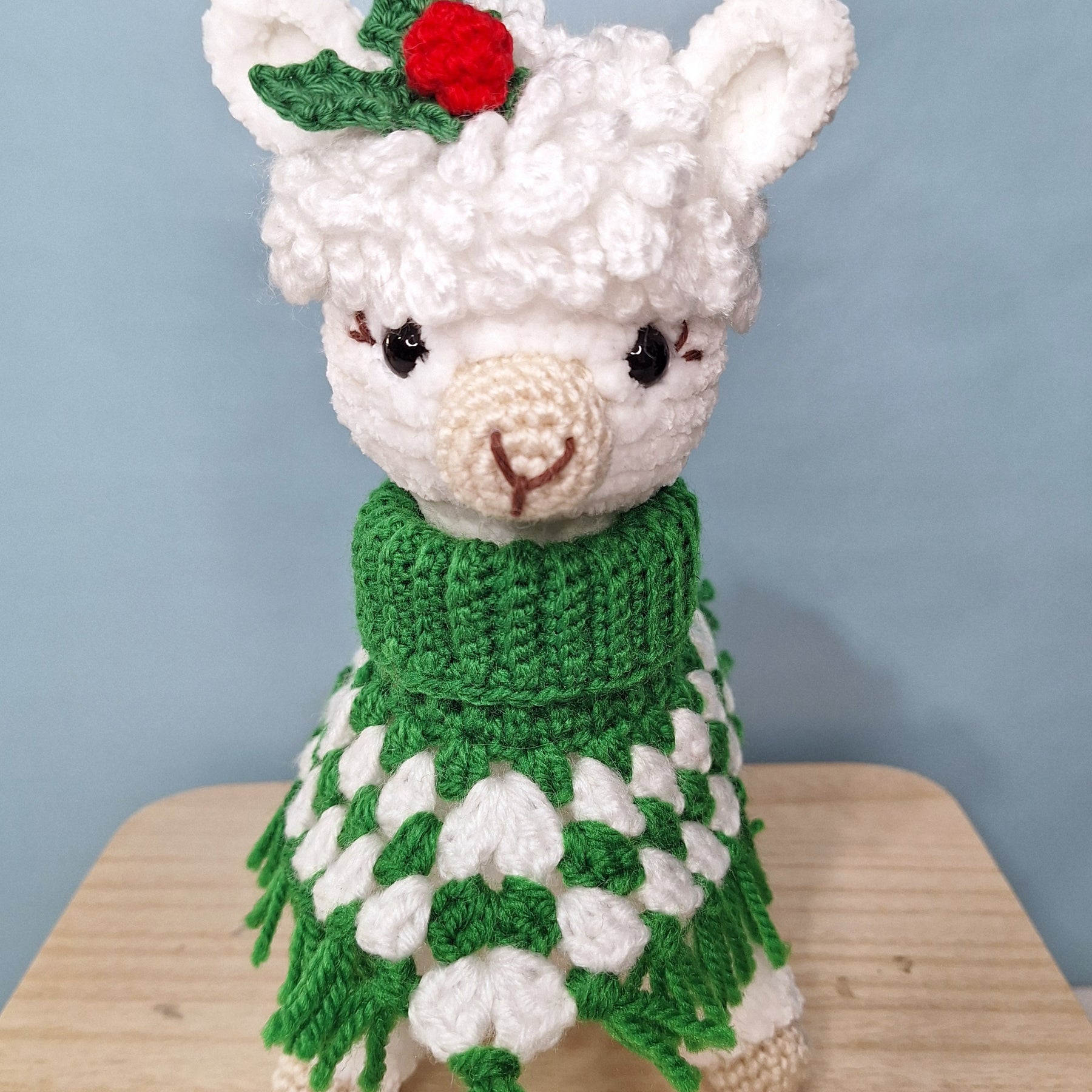 Crocheted Christmas Alpaca wearing a Poncho