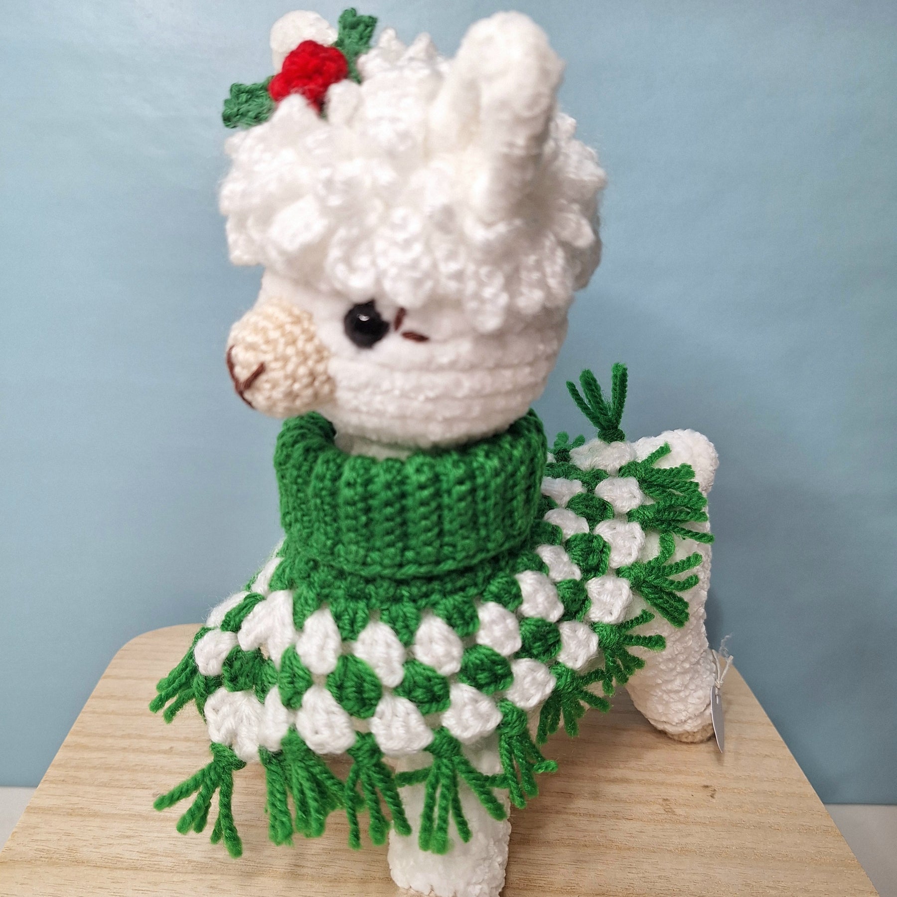 Crocheted Christmas Alpaca wearing a Poncho