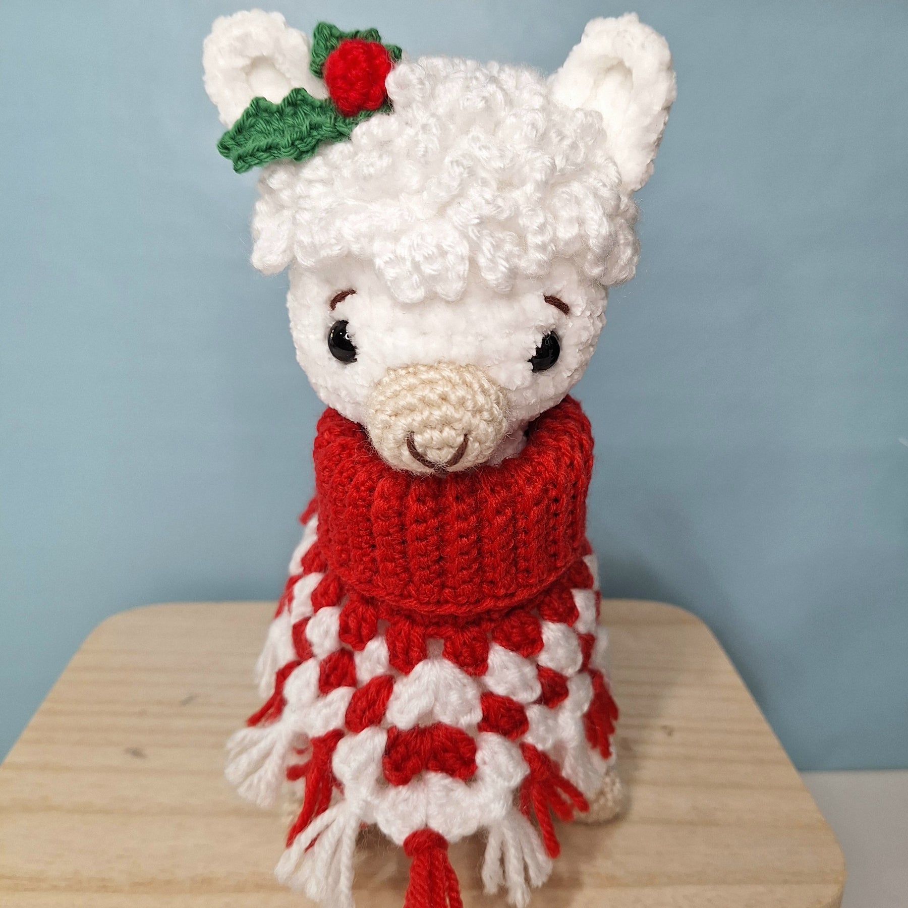 Crocheted Christmas Alpaca wearing a Poncho
