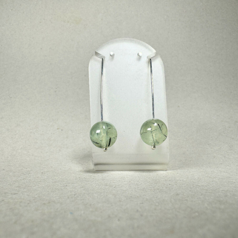 Prehnite earrings on stand