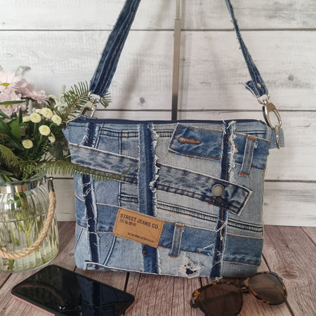 Handmade upcycled angle patched denim zip crossbody bag