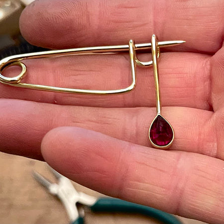Brass and Ruby teardrop brooch