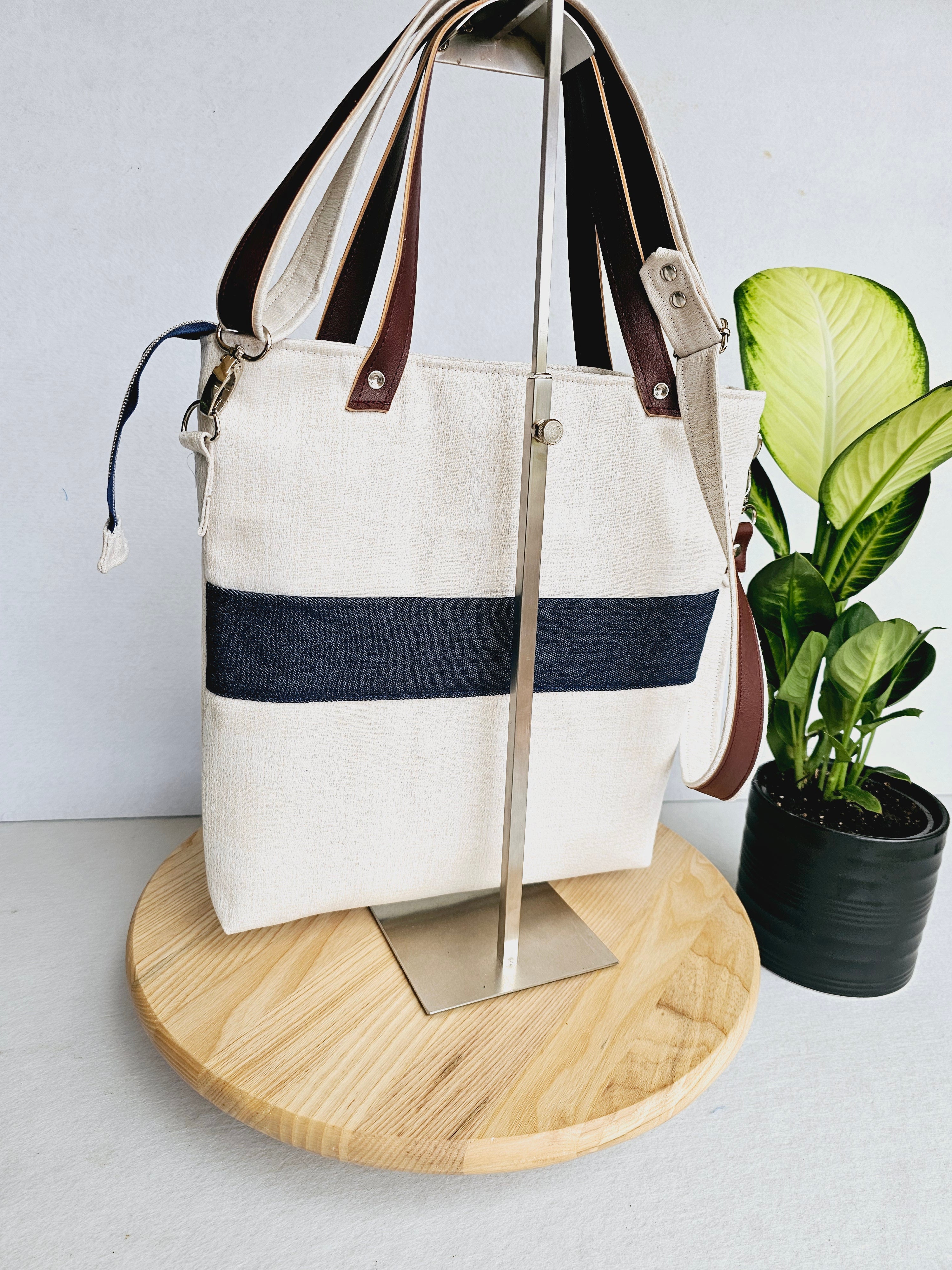 Modern hummingbird cross body bag featuring empowering words with ajustable strap