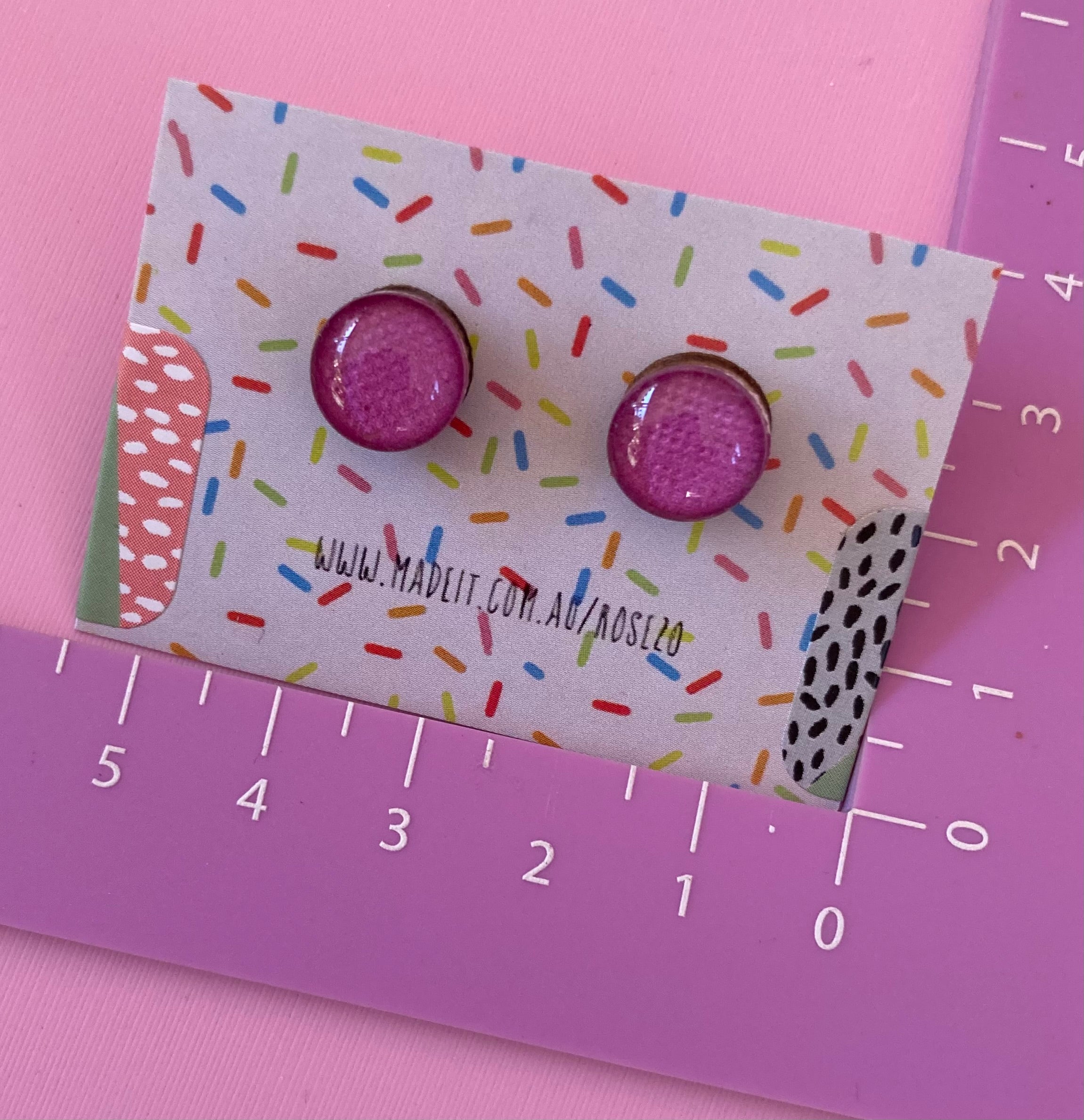 Magenta glass domed studs