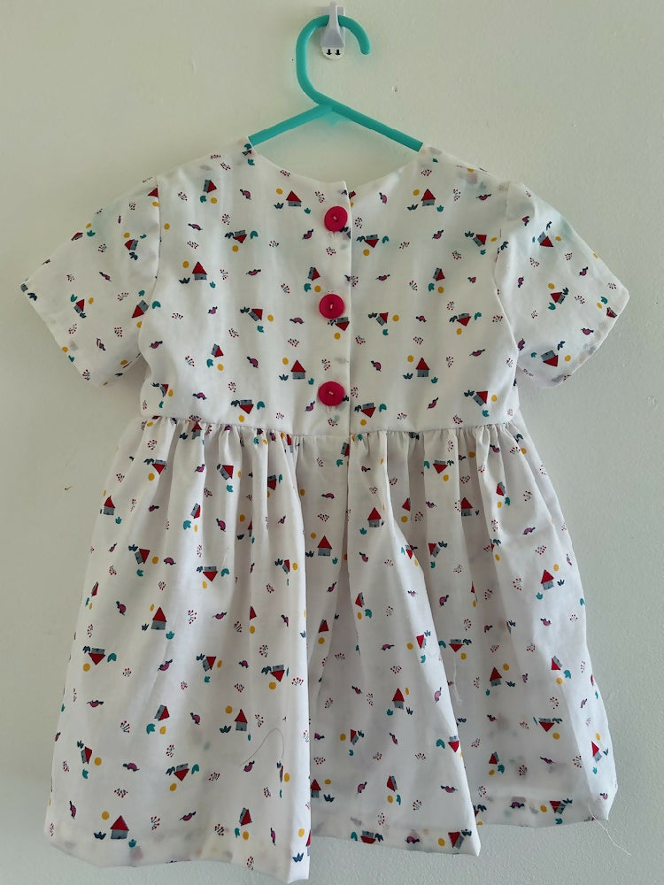 Tiny red house on this dress size 1