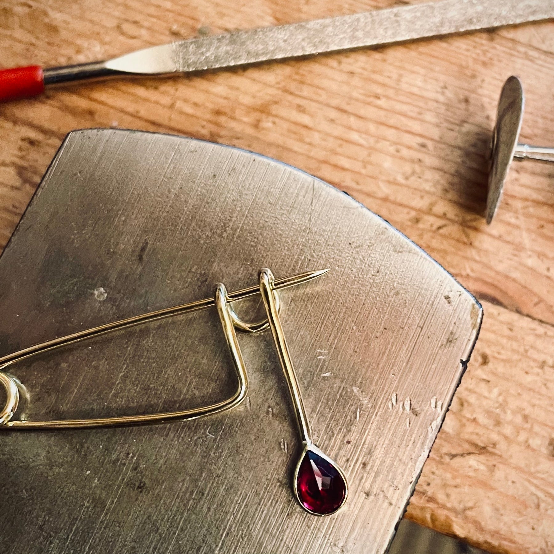 Brass and Ruby teardrop brooch