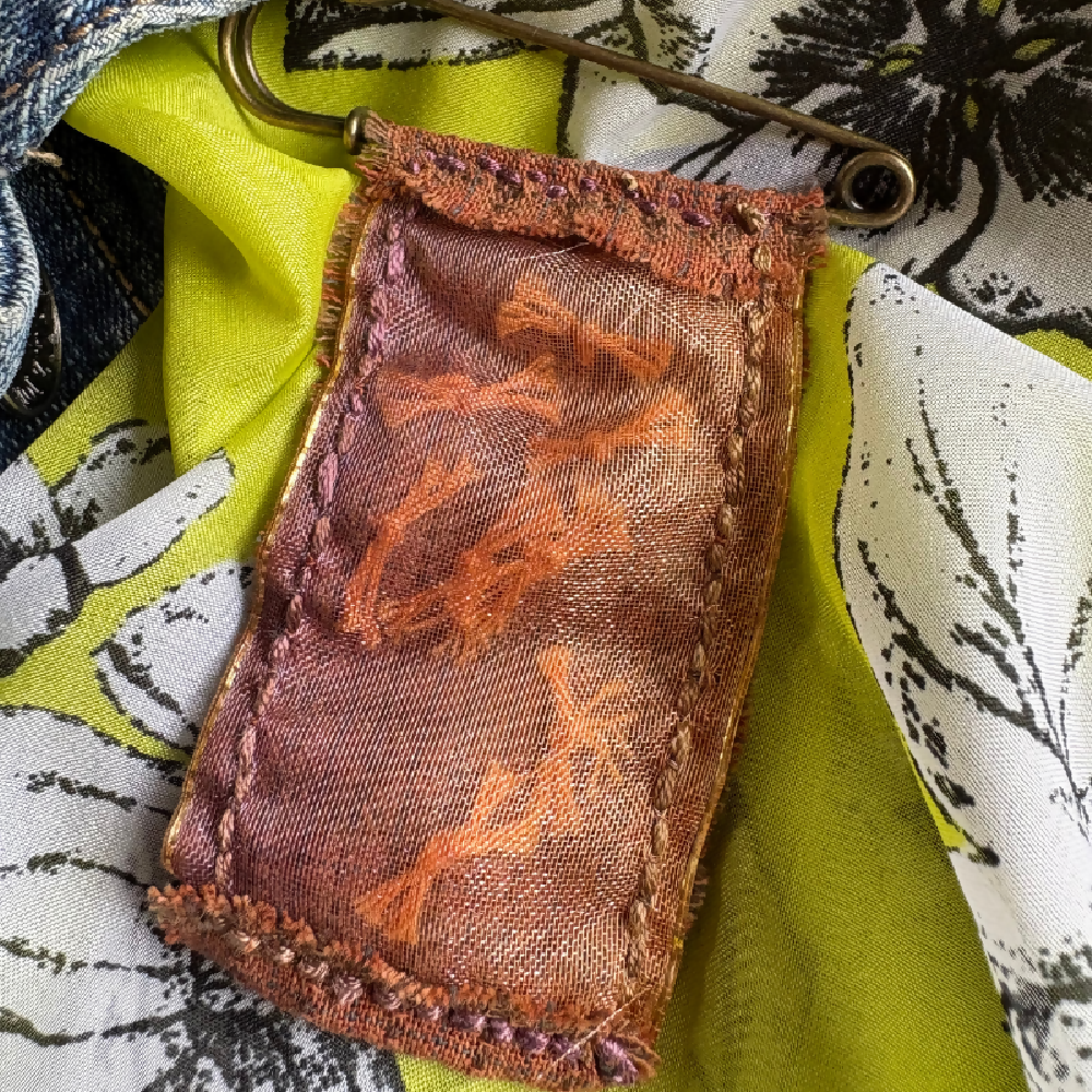 Buttoned and hand stitched brooch by Leumesin Handmade