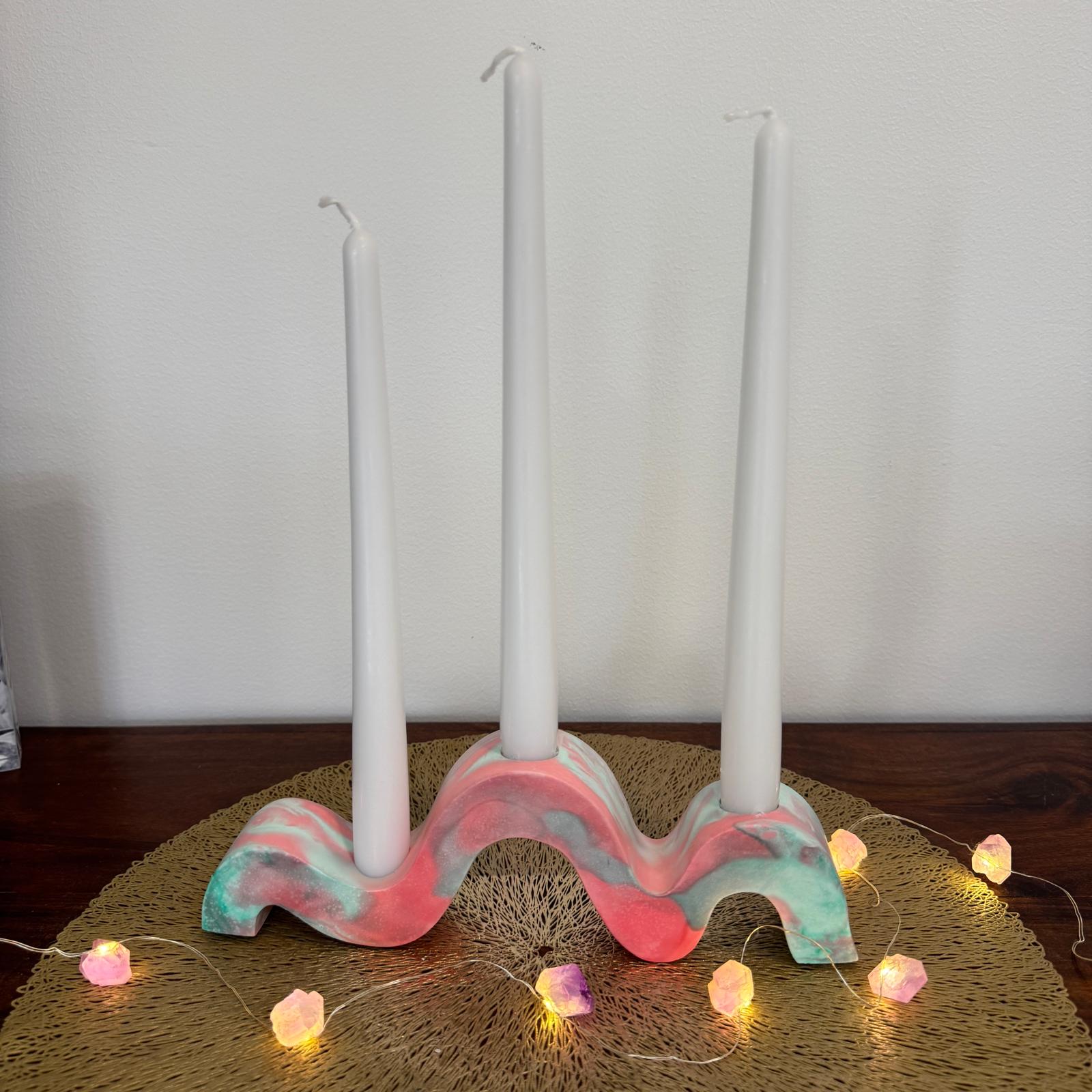 Red and green and gold wavy concrete holder for taper candles
