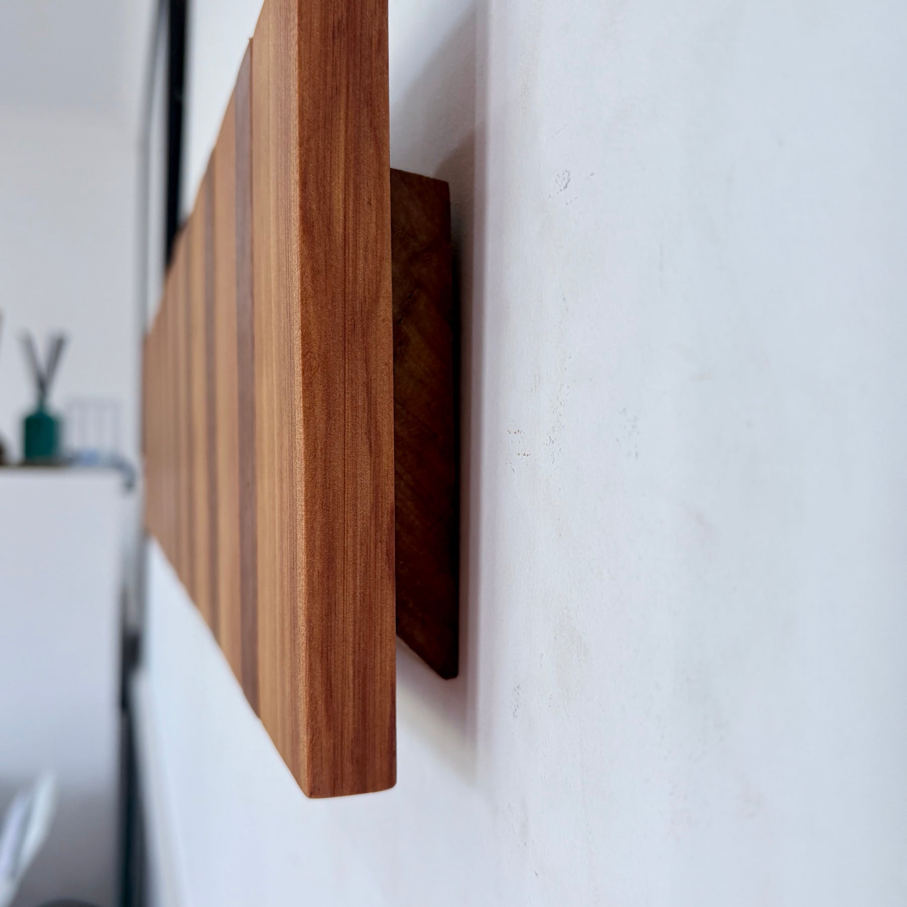 Two tone spotted gum and cypress horizon line piano style coatrack