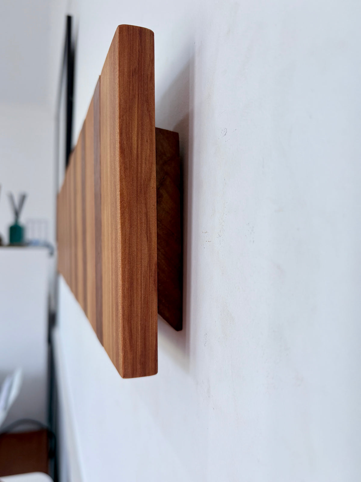 Two tone spotted gum and cypress horizon line piano style coatrack