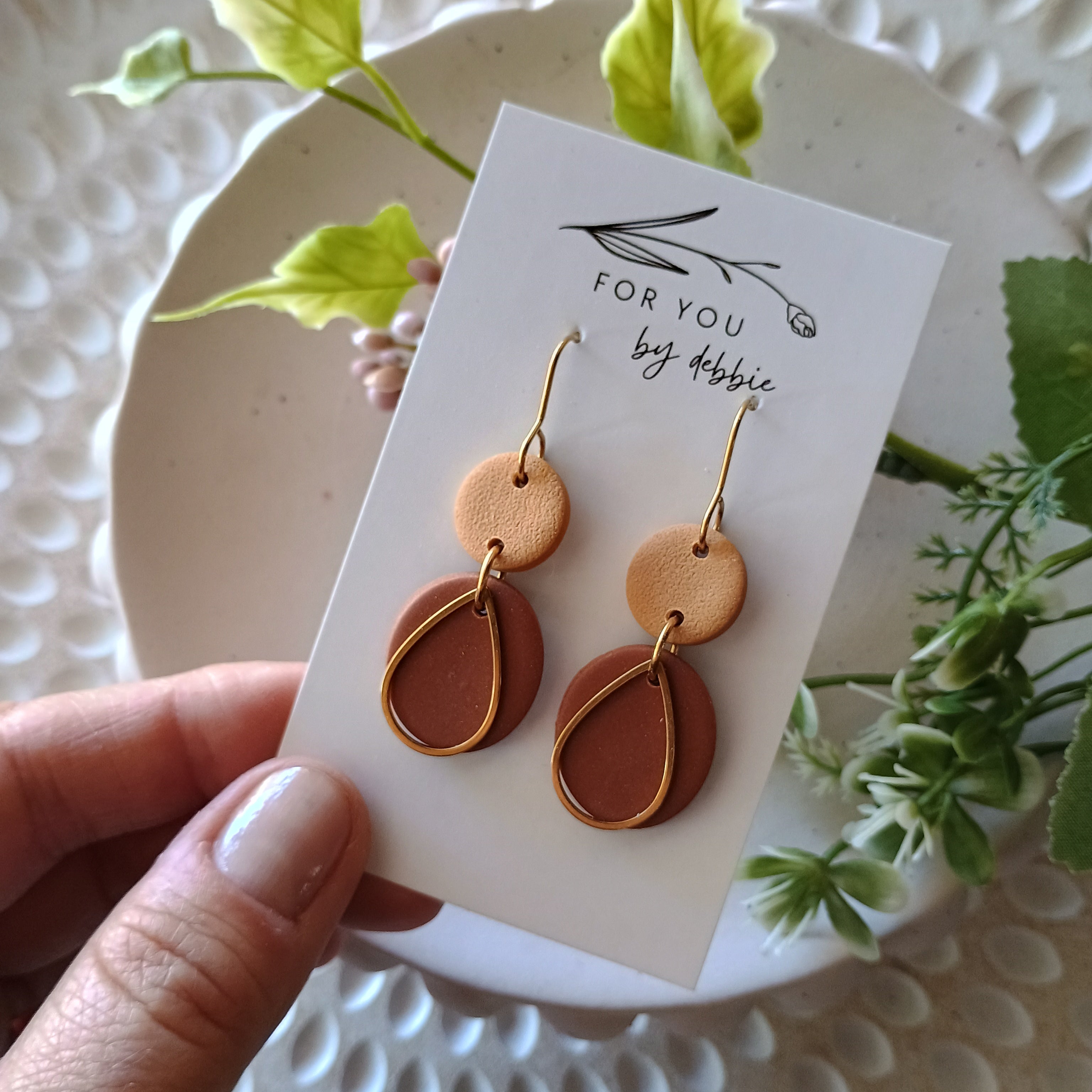 Brown and gold dangle earrings with teardrop charm