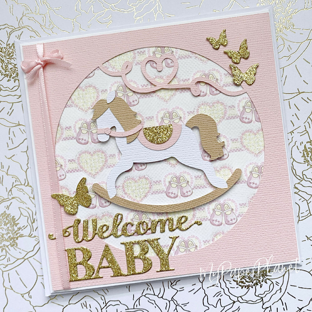 Rocking horse, new baby girl card. Welcome baby in pink.