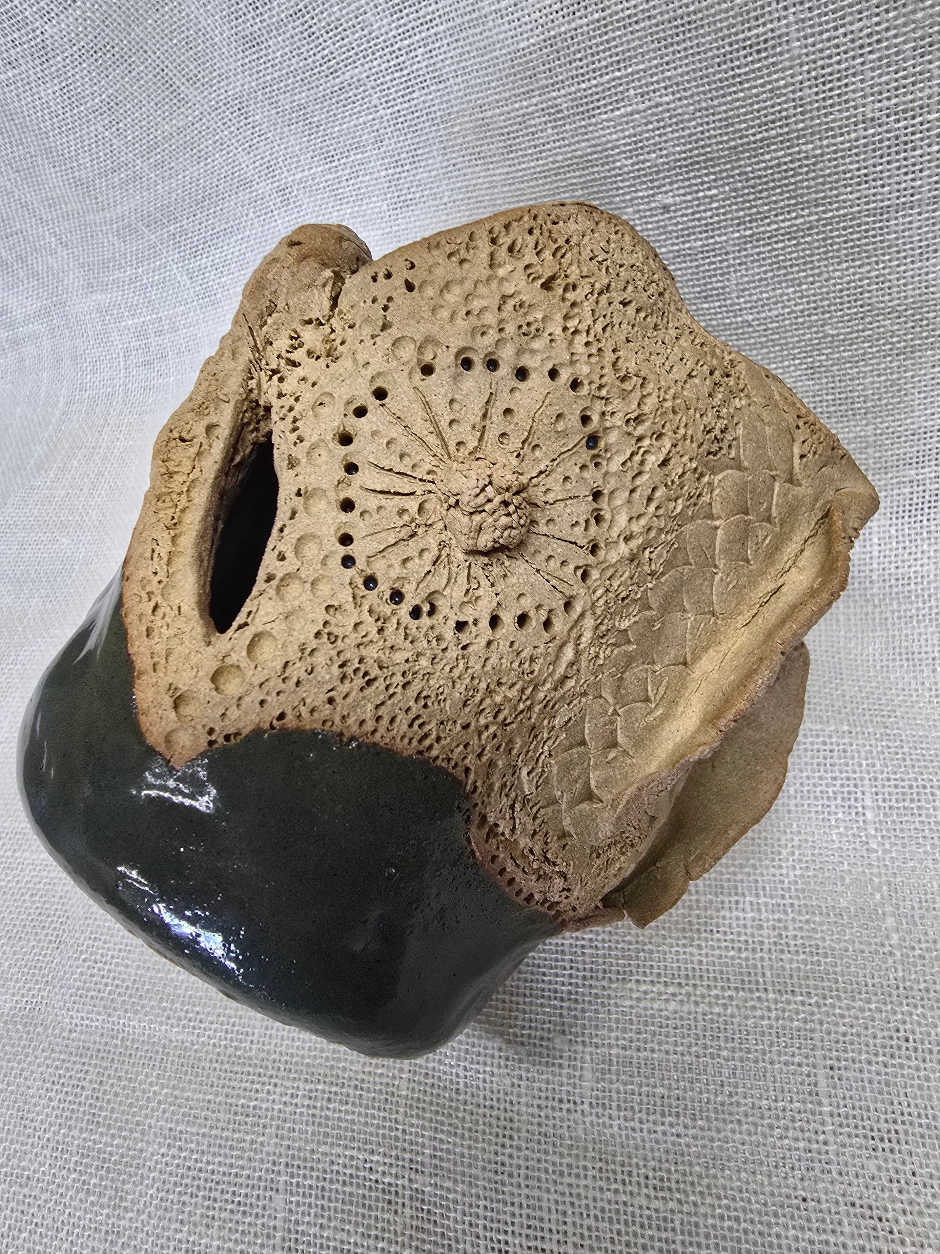 Rockpool series.  Stunning, hand carved pot