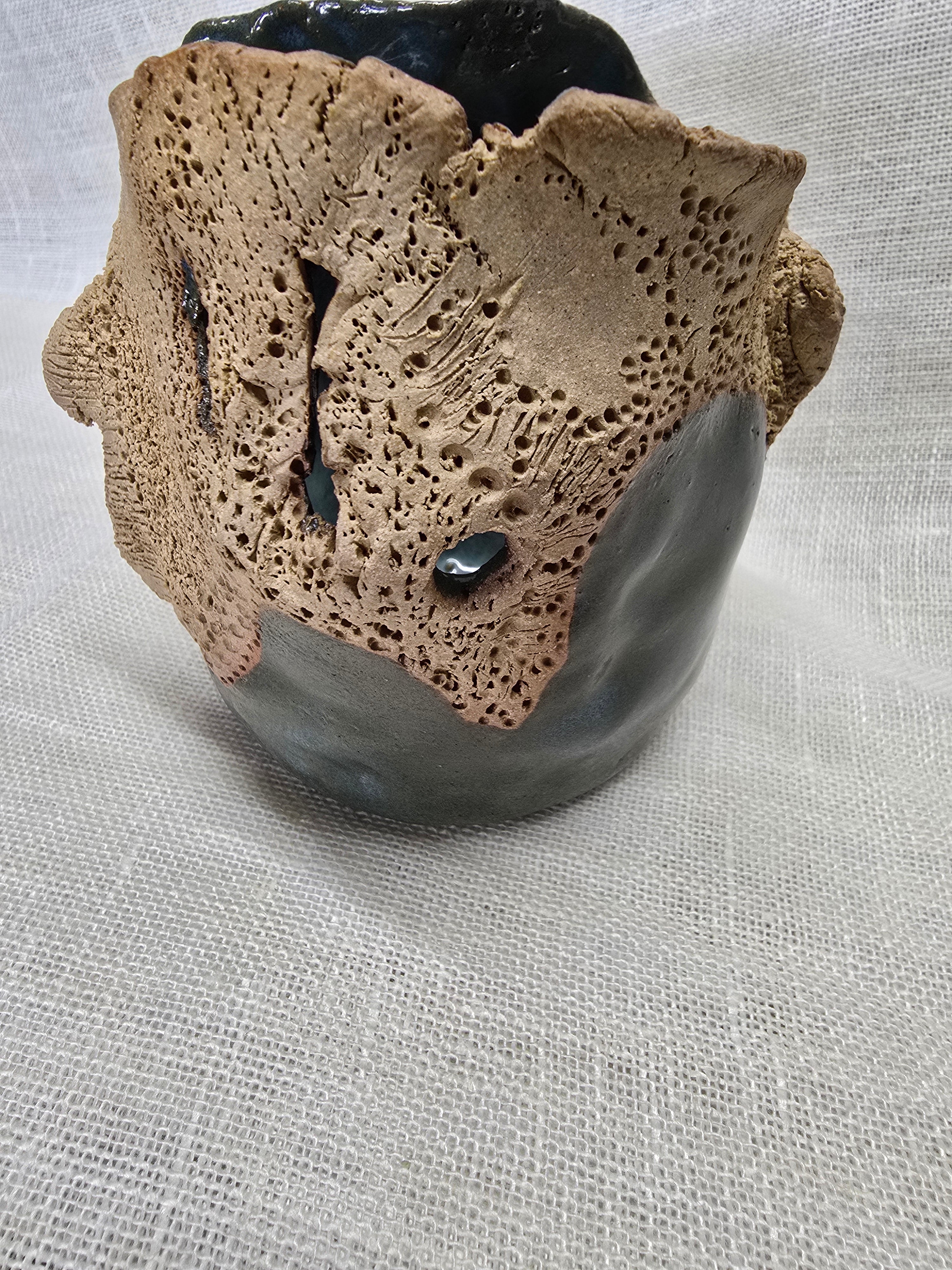 Rockpool series.  Stunning, hand carved pot