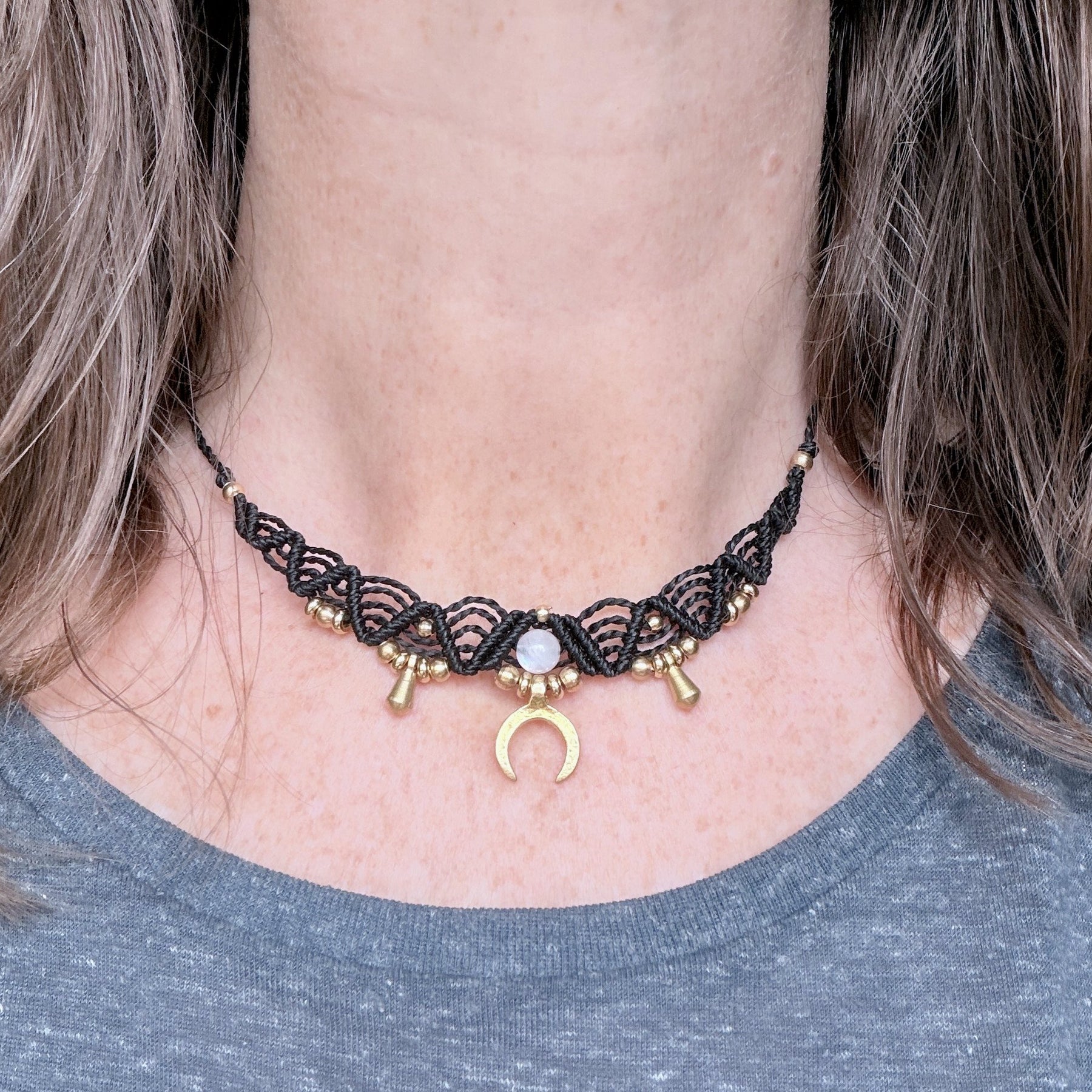 Macrame Boho Collier with gemstone bead and brass charms.
