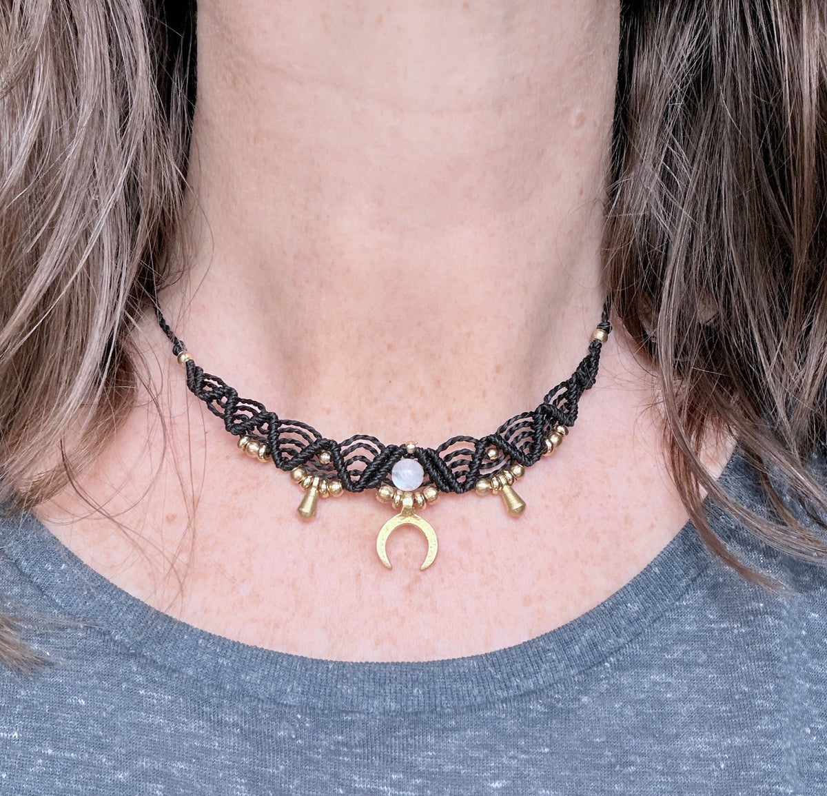 Macrame Boho Collier with gemstone bead and brass charms.