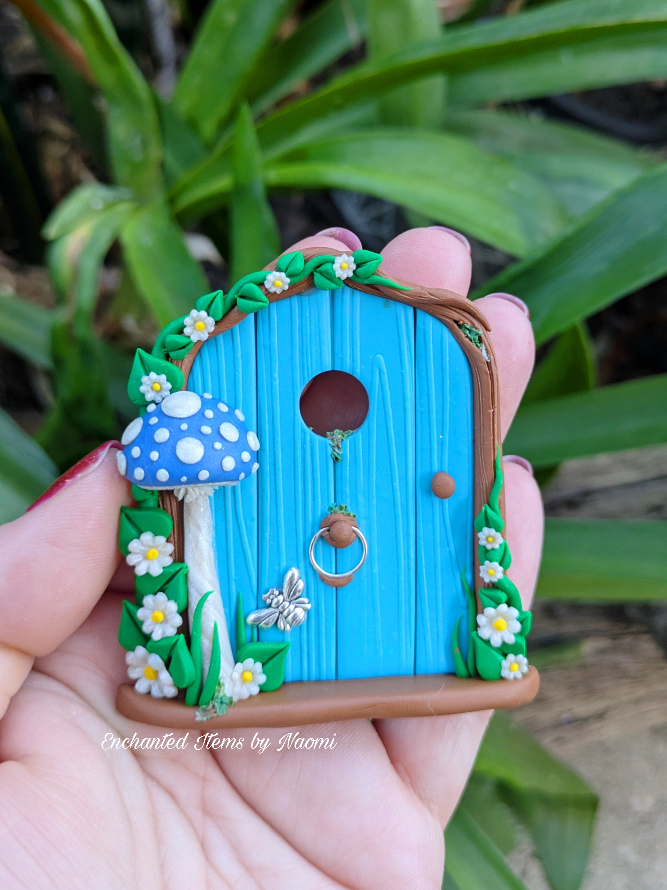 Mini Blue Fairy Door with a Mushroom, Flowers & Silver Bumblebee