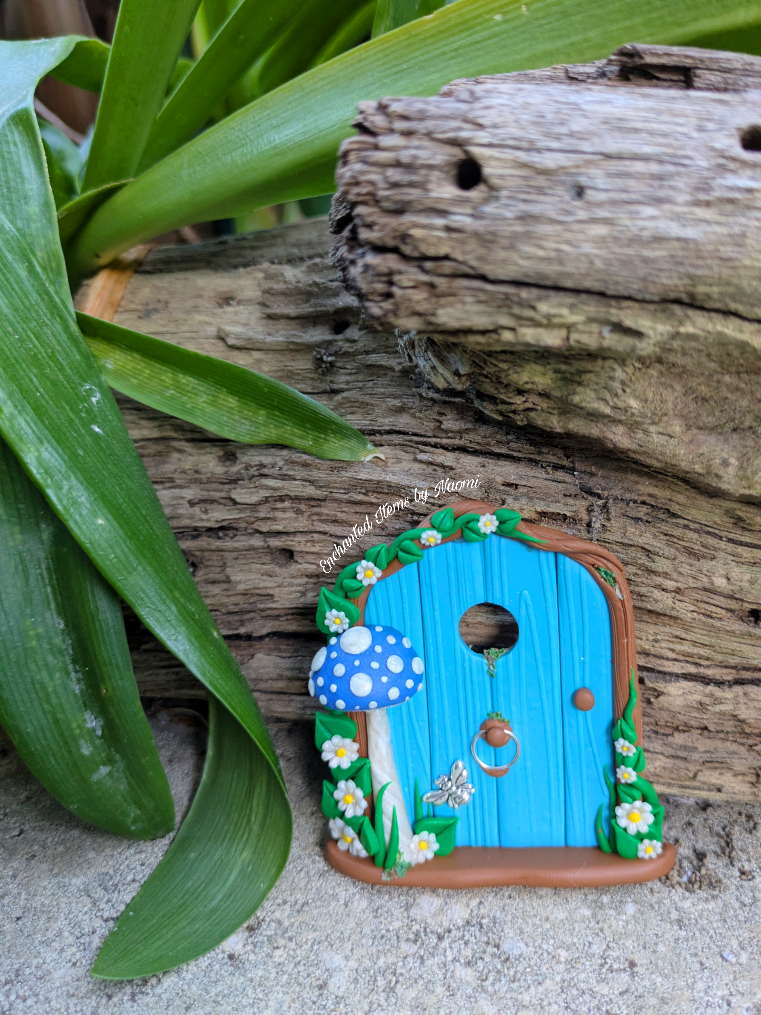 Mini Blue Fairy Door with a Mushroom, Flowers & Silver Bumblebee