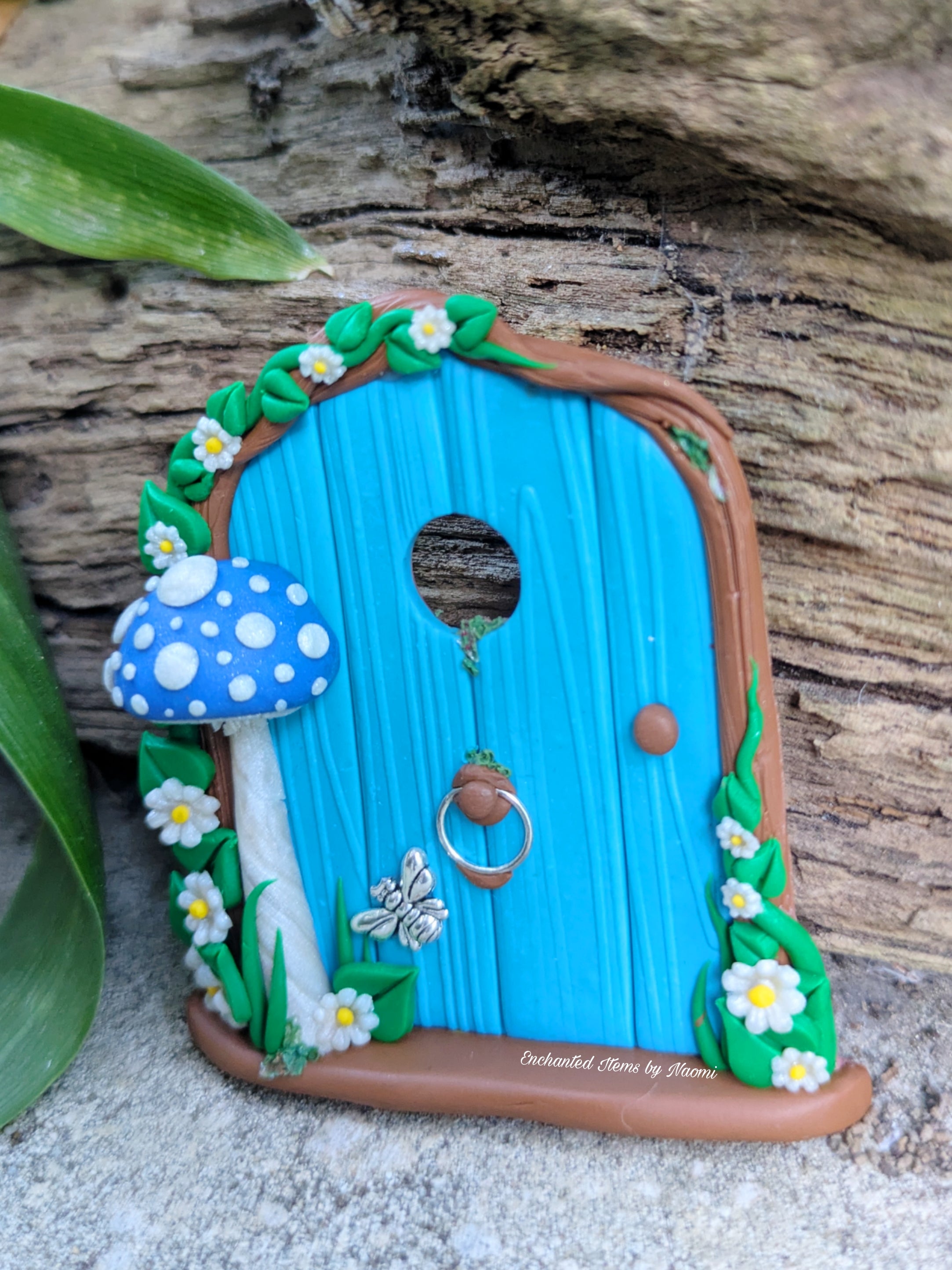 Mini Blue Fairy Door with a Mushroom, Flowers & Silver Bumblebee