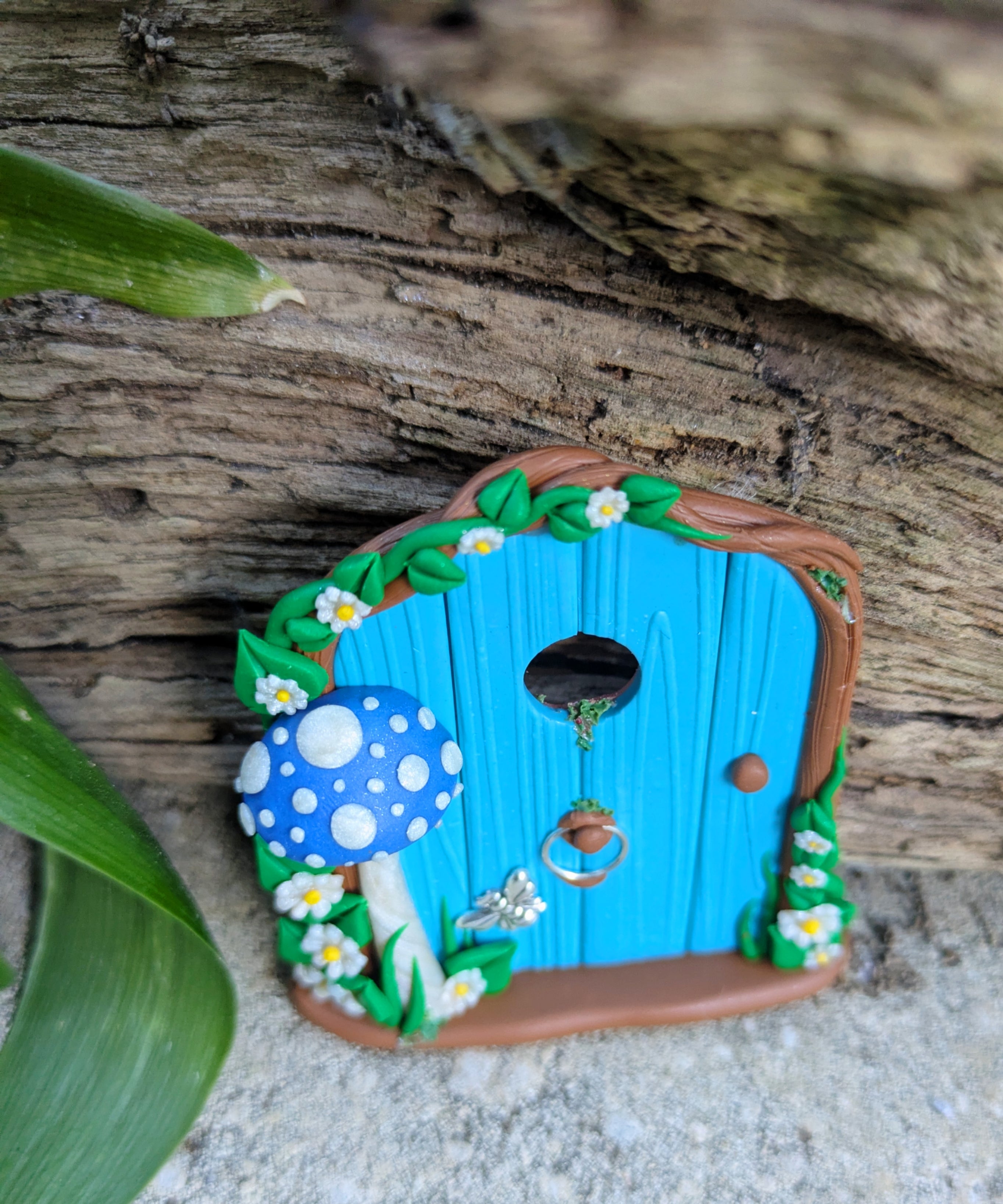 Mini Blue Fairy Door with a Mushroom, Flowers & Silver Bumblebee