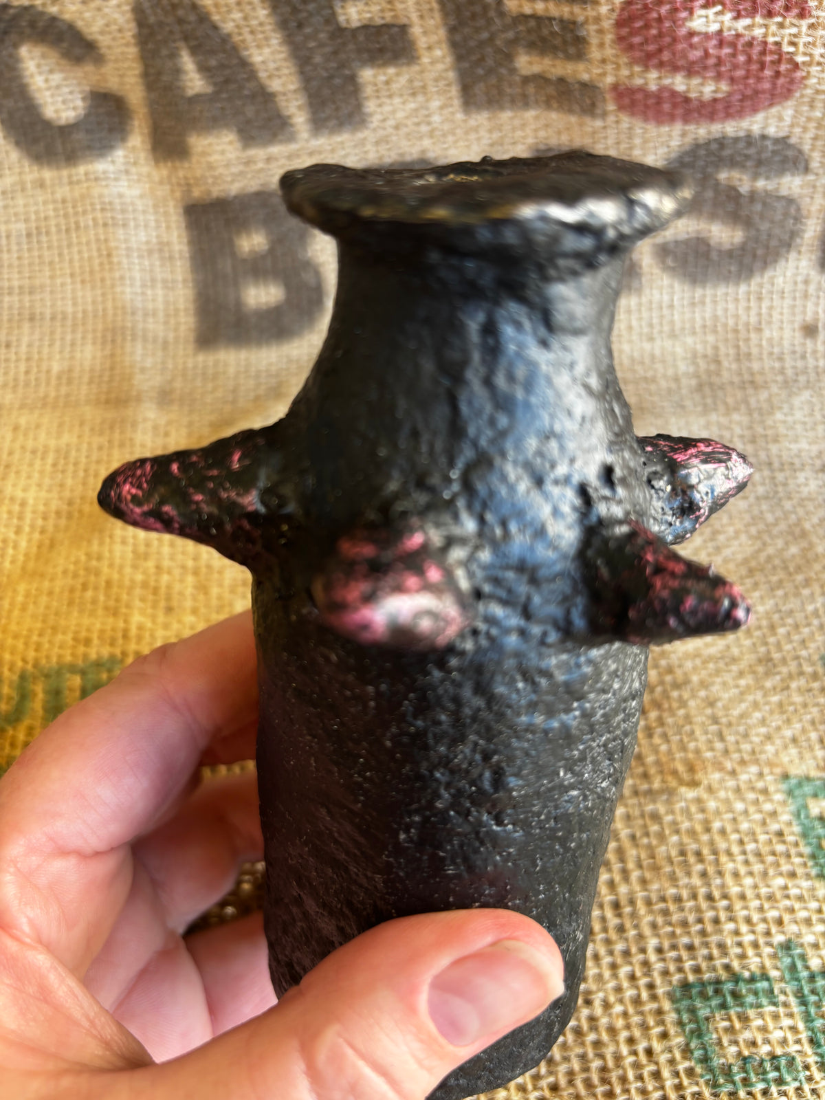 Small vase with pinkish studs