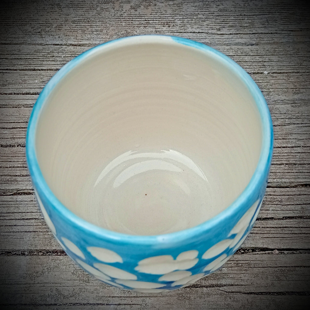 Blue and white abstract clouds cup