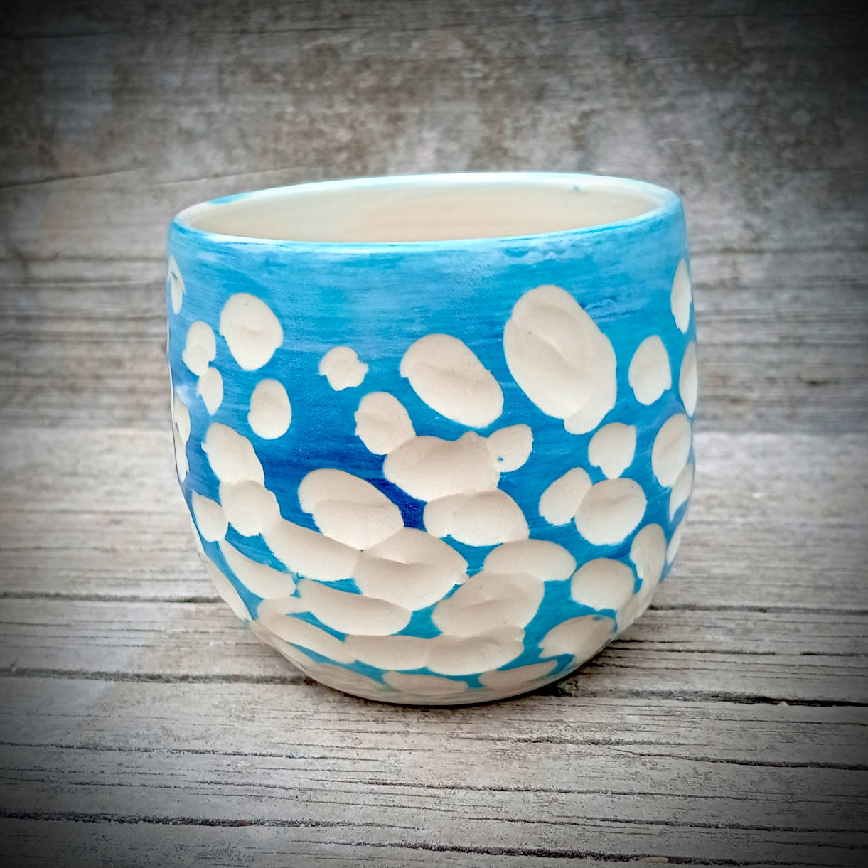 Blue and white abstract clouds cup