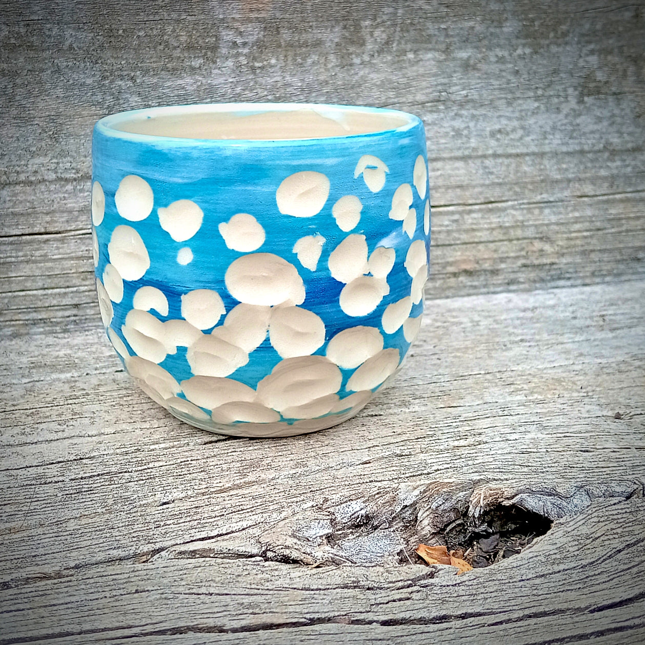 Blue and white abstract clouds cup