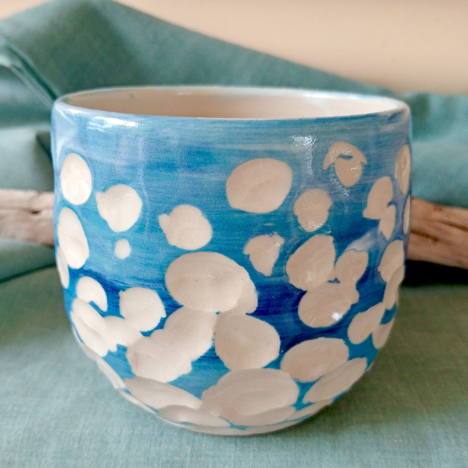Blue and white abstract clouds cup