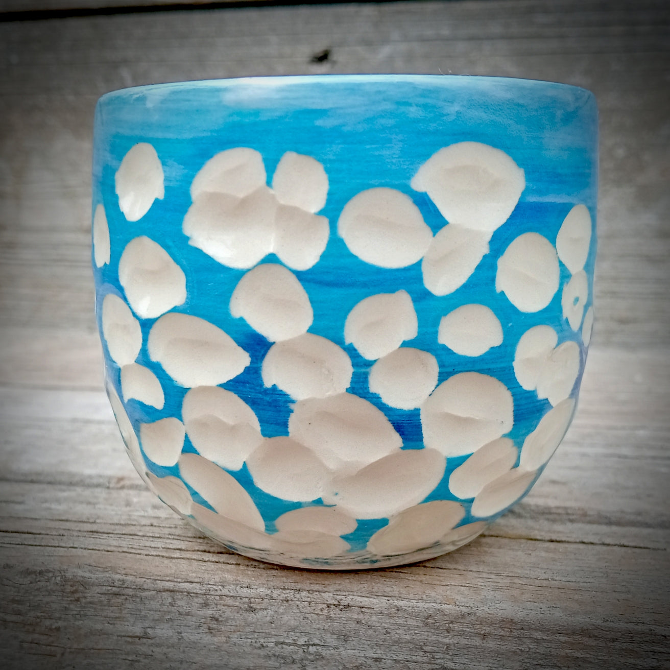 Blue and white abstract clouds cup