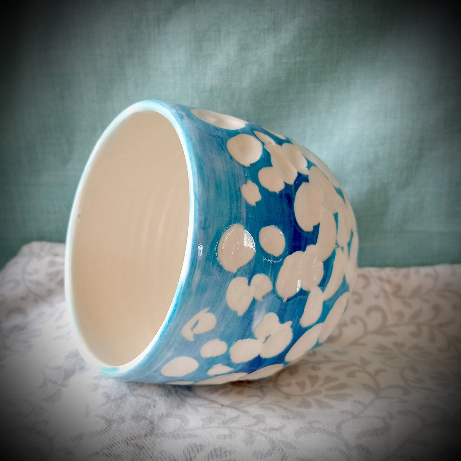 Blue and white abstract clouds cup