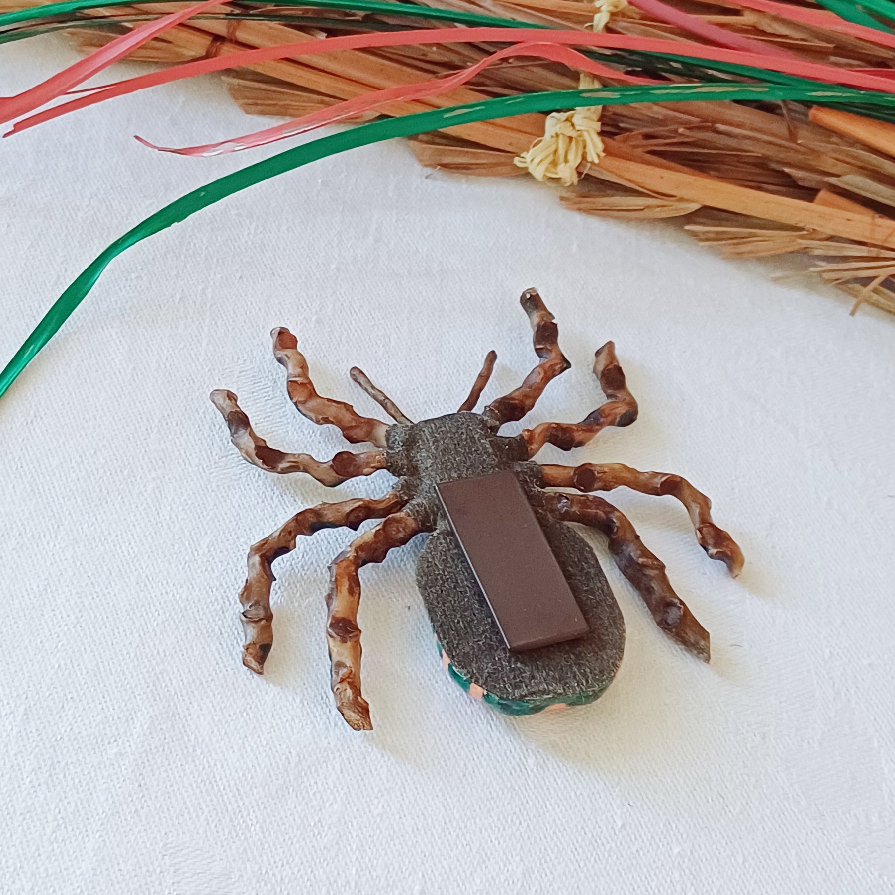 Hand painted teal palm leaf clay spider keepsake with magnet