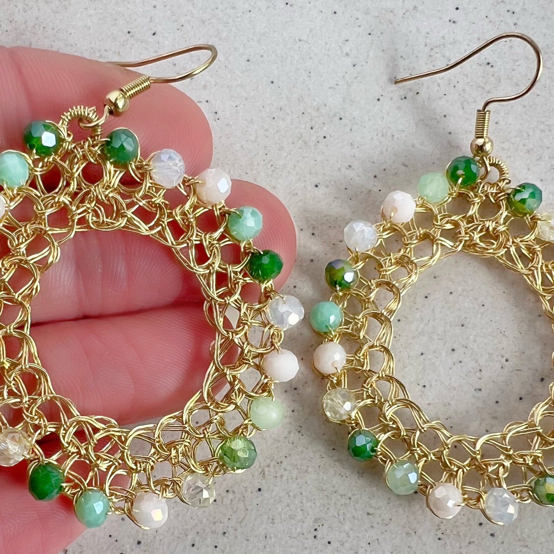 Gold wire hoop earrings with crystals