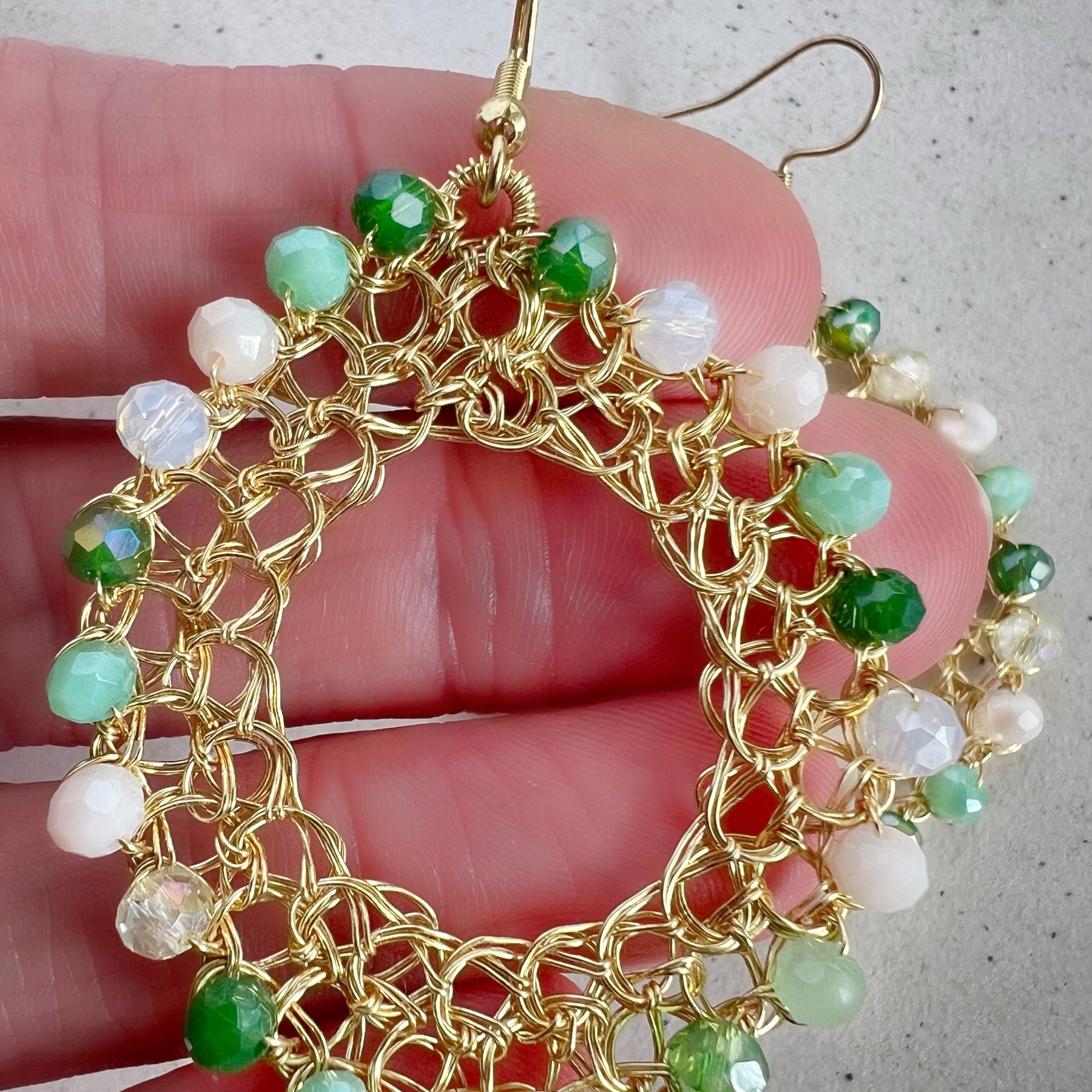 Gold wire hoop earrings with crystals