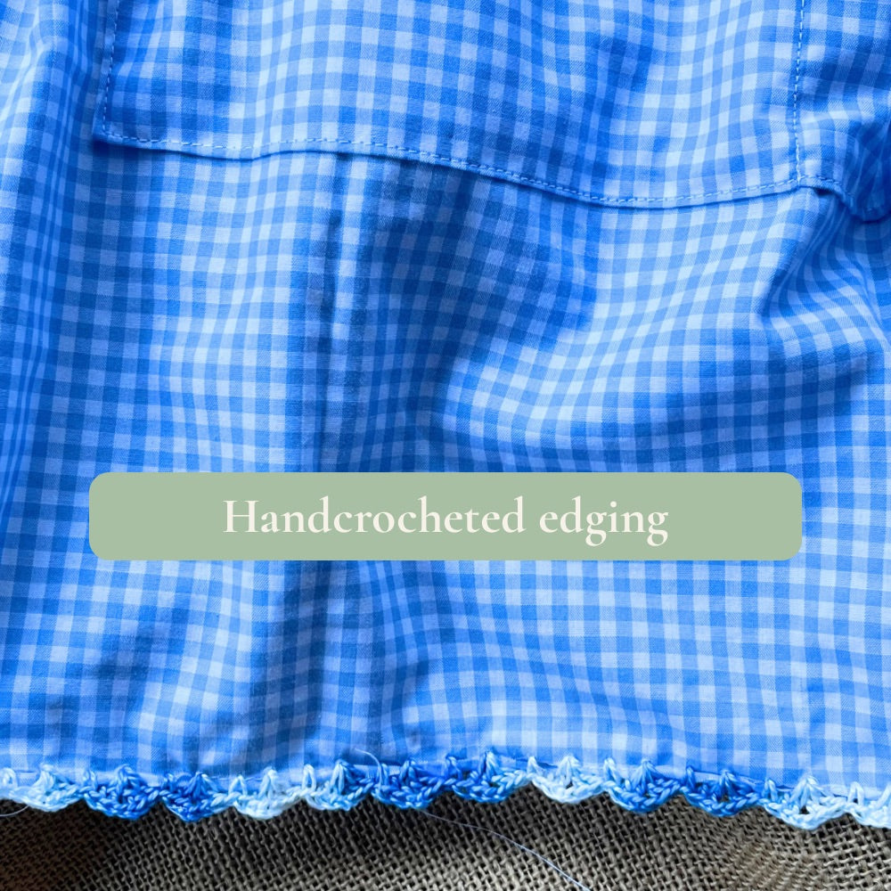 Blue gingham apron with hand crocheted lady
