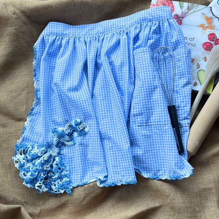 Blue gingham apron with hand crocheted lady