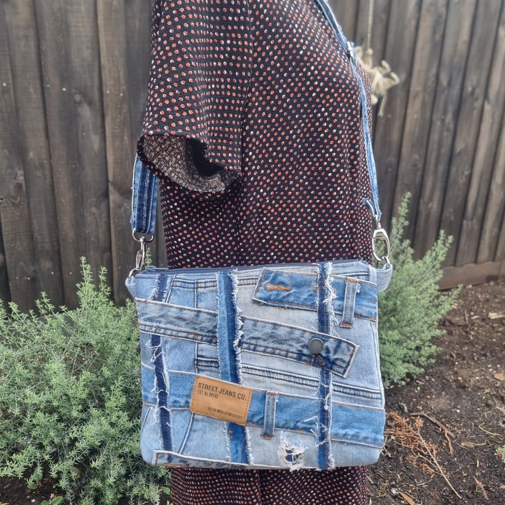Handmade upcycled angle patched denim zip crossbody bag