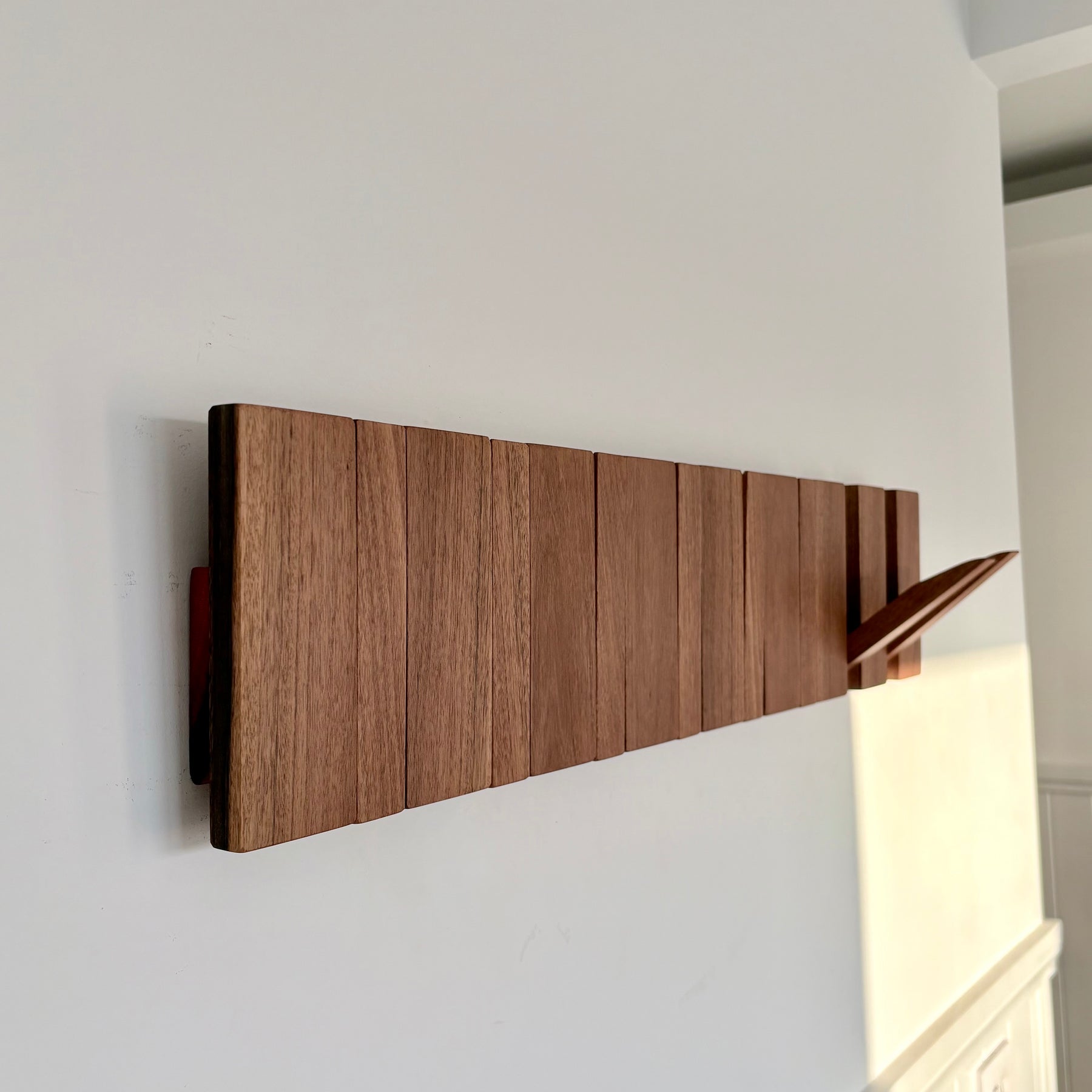 Grey box piano style coat rack