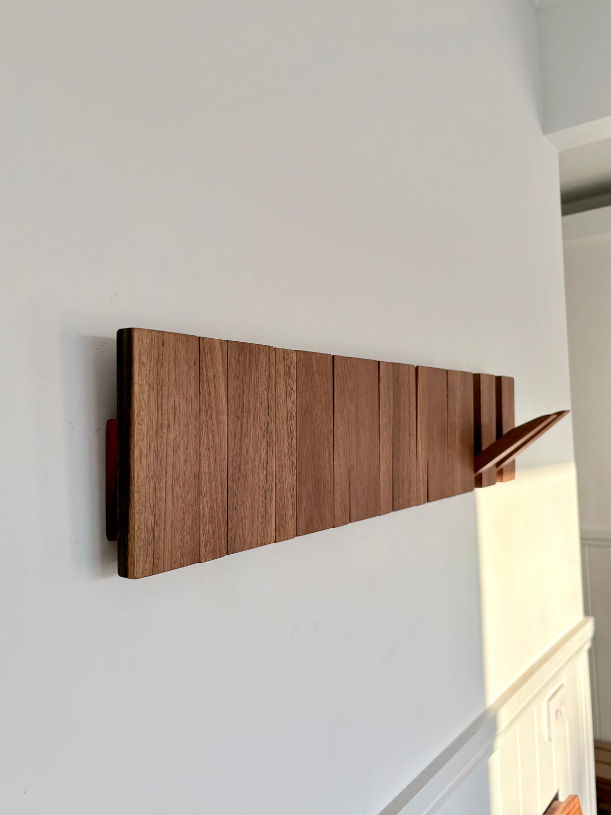 Grey box piano style coat rack