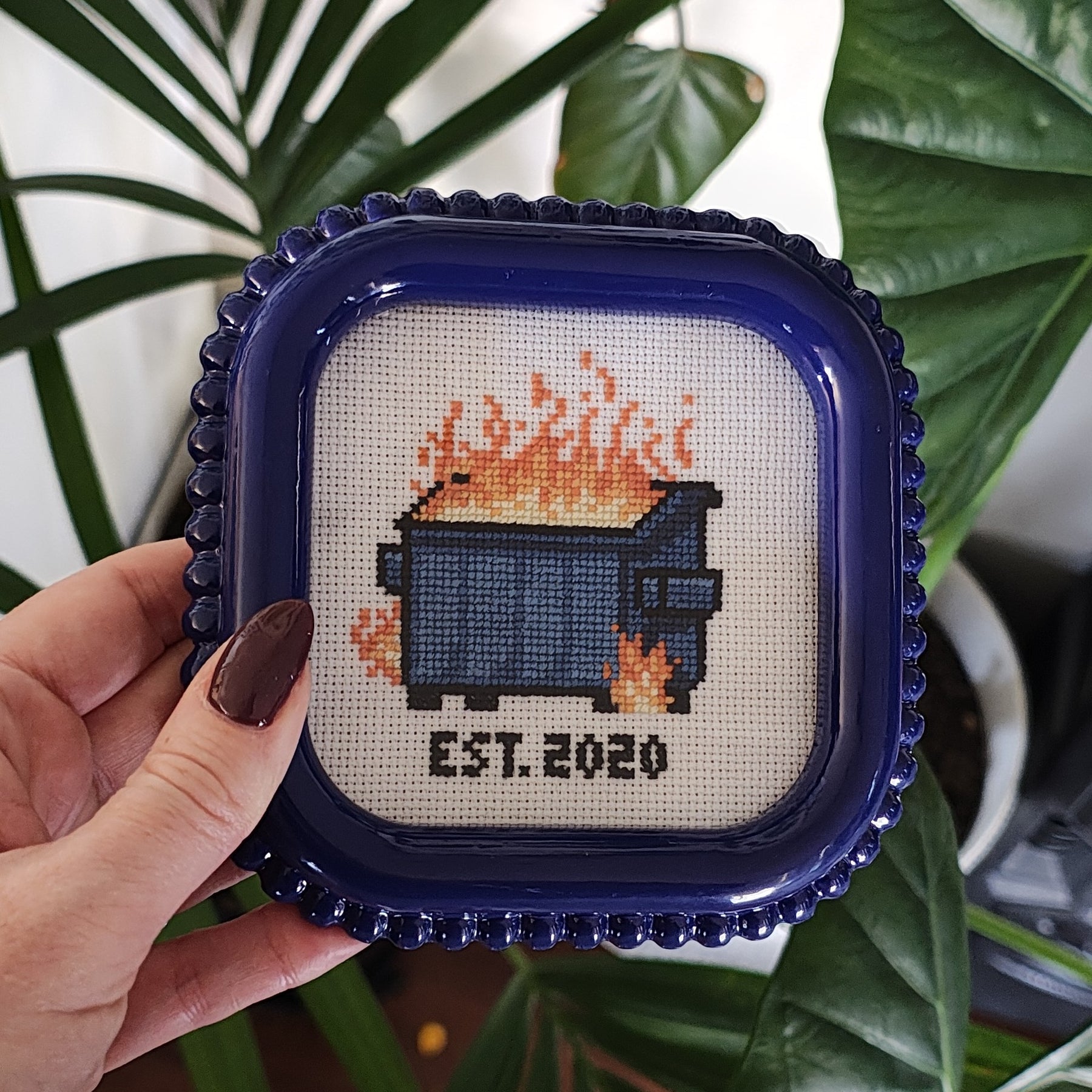 "Dumpster fire" framed cross stitch