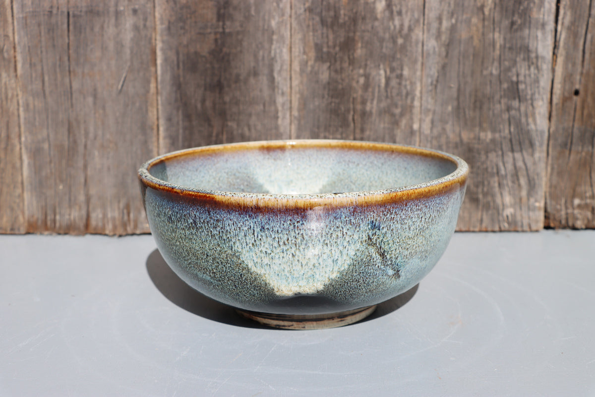 Stoneware bowls hand made with white speckled chun glaze over teadust brown.