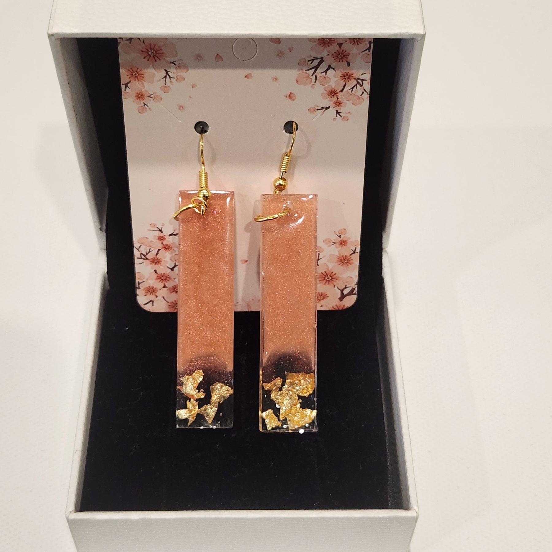 Drop earrings with metallic accents